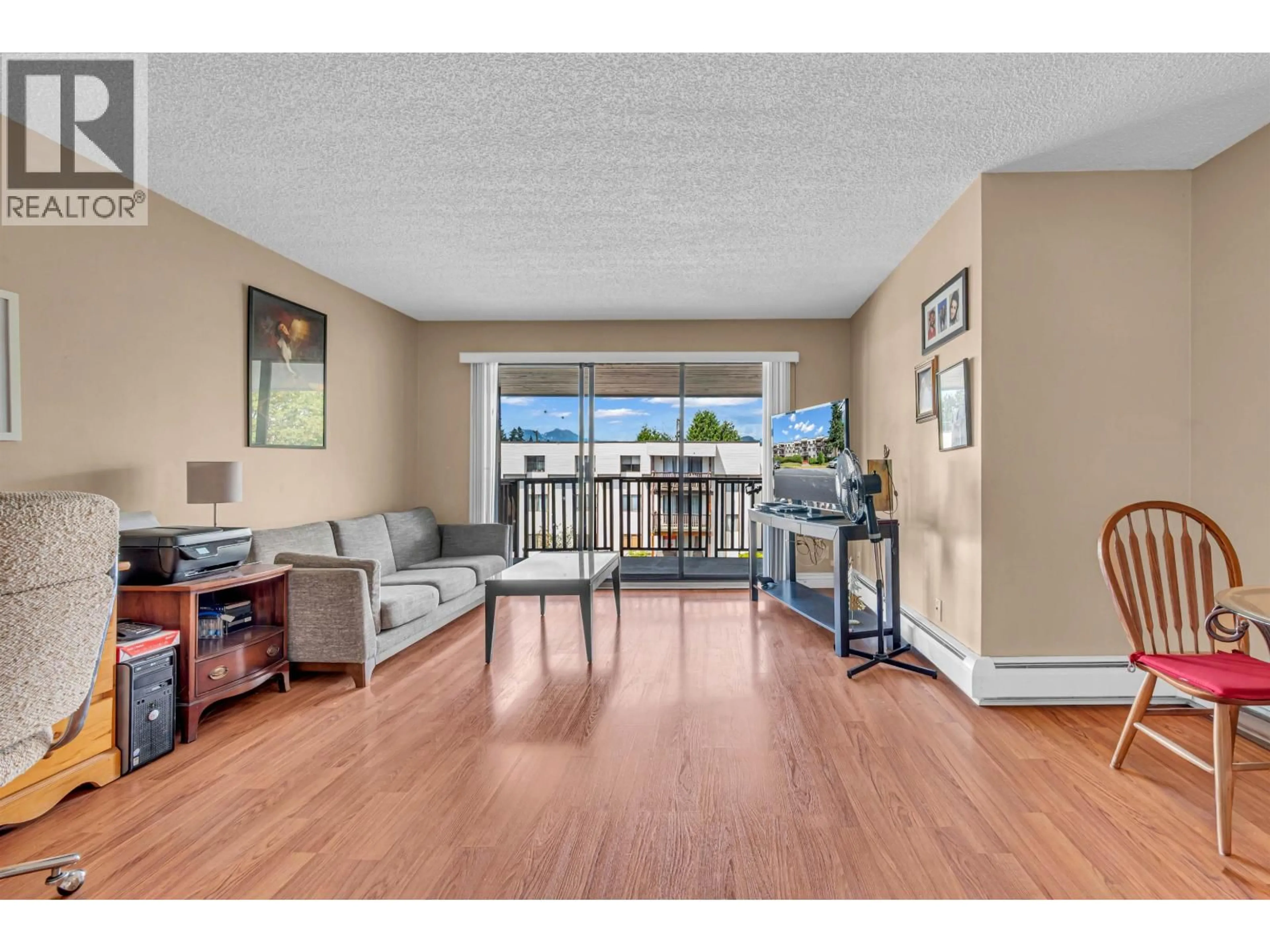 Living room with furniture, wood/laminate floor for 311 - 12170 222 STREET, Maple Ridge British Columbia V2X8H1