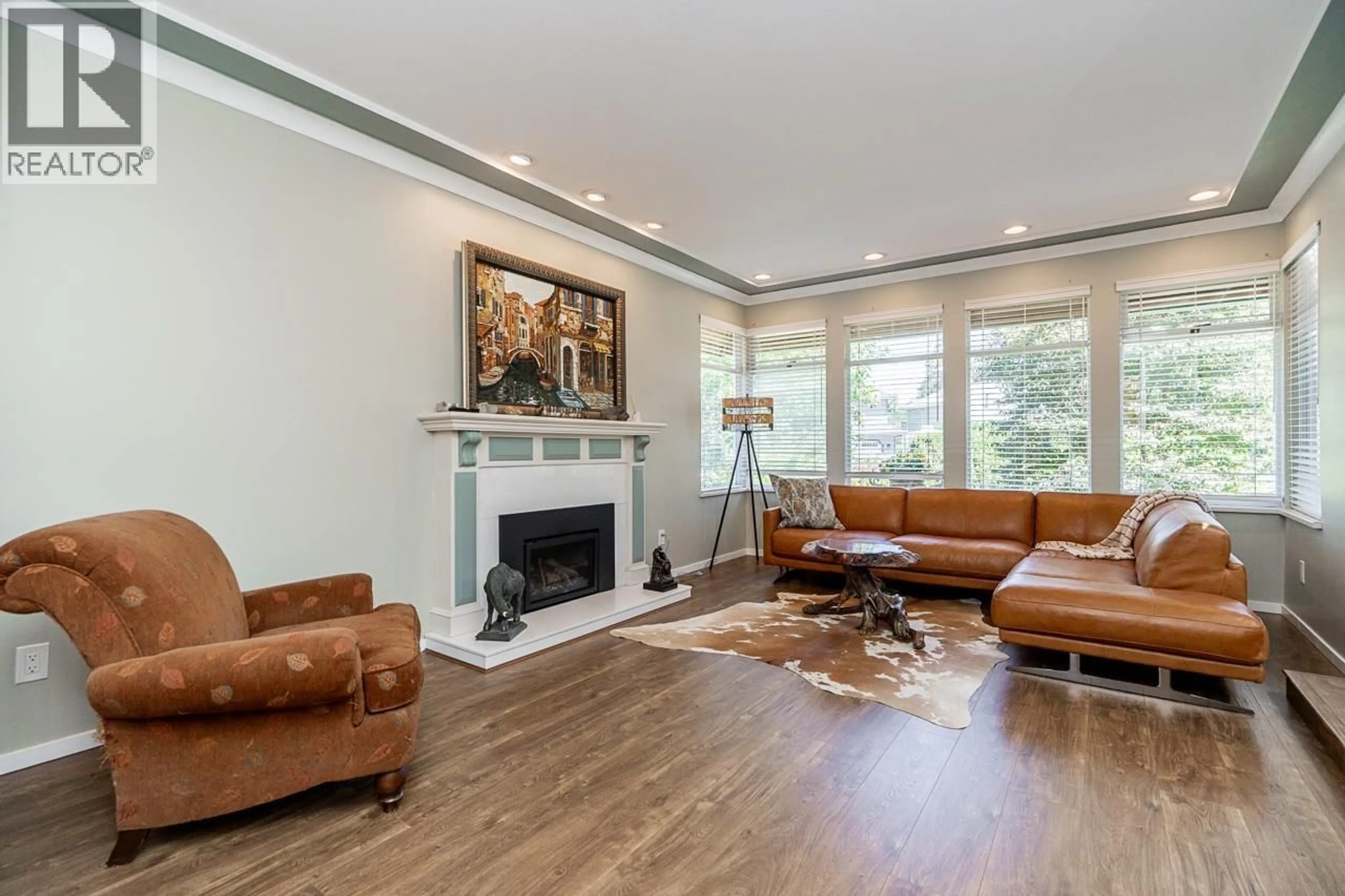 Living room with furniture, wood/laminate floor for 12461 205 STREET, Maple Ridge British Columbia V2X0B1