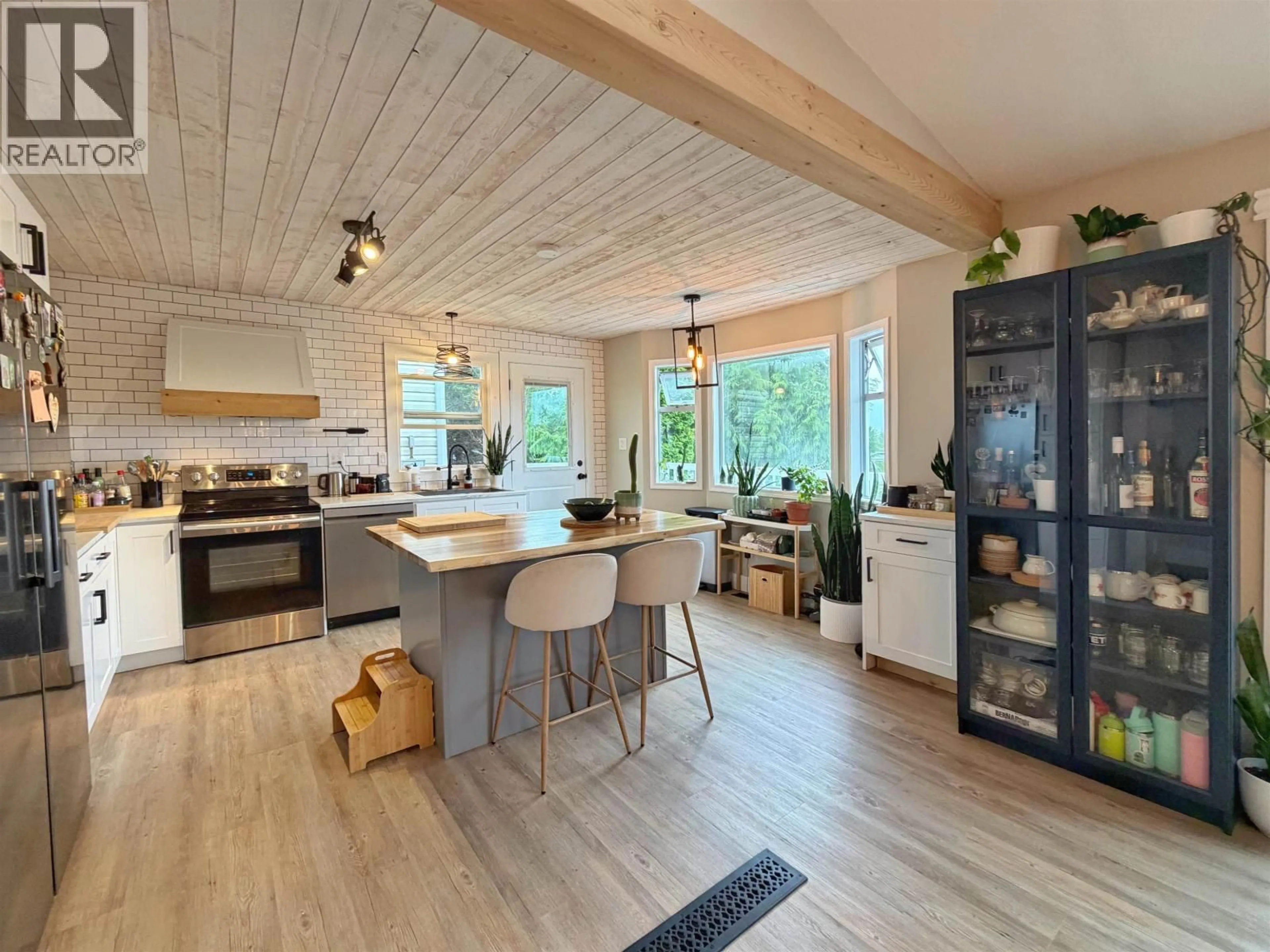Open concept kitchen, wood/laminate floor for 1249 CONRAD STREET, Prince Rupert British Columbia V8J4M5