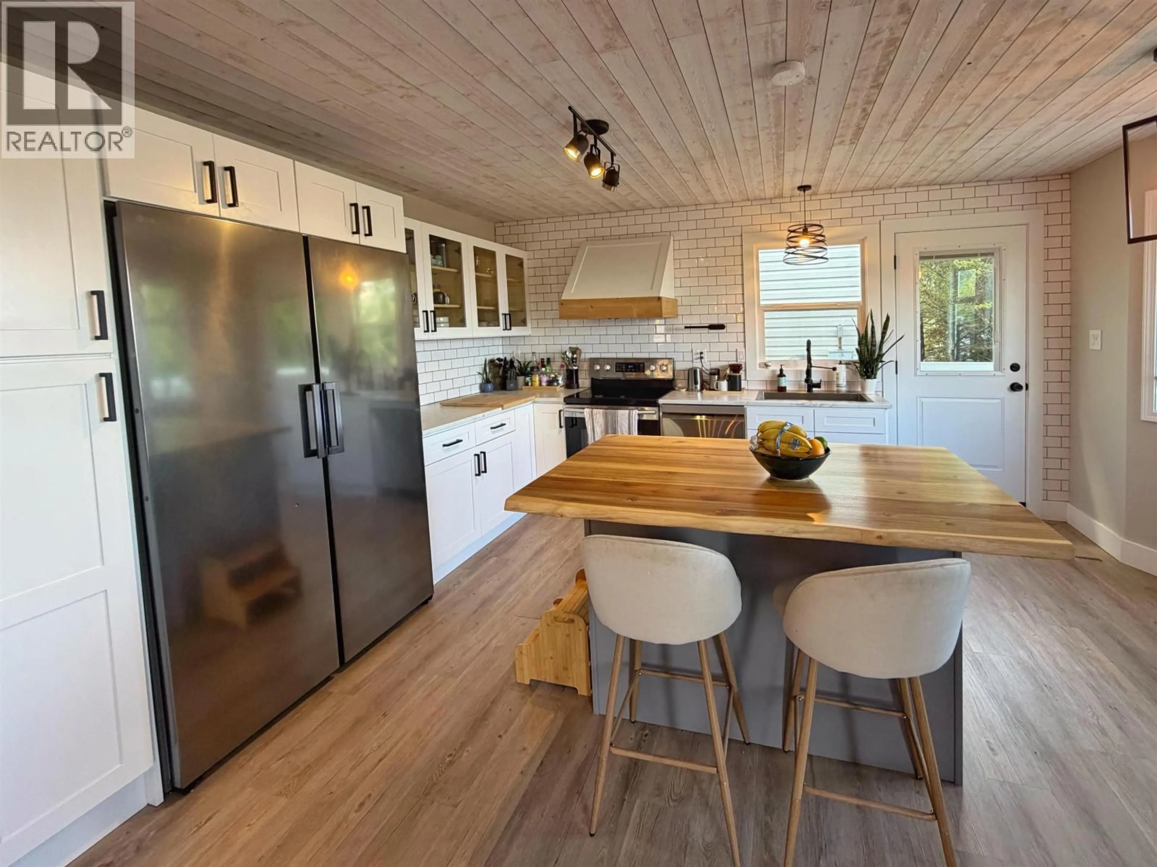 Open concept kitchen, wood/laminate floor for 1249 CONRAD STREET, Prince Rupert British Columbia V8J4M5