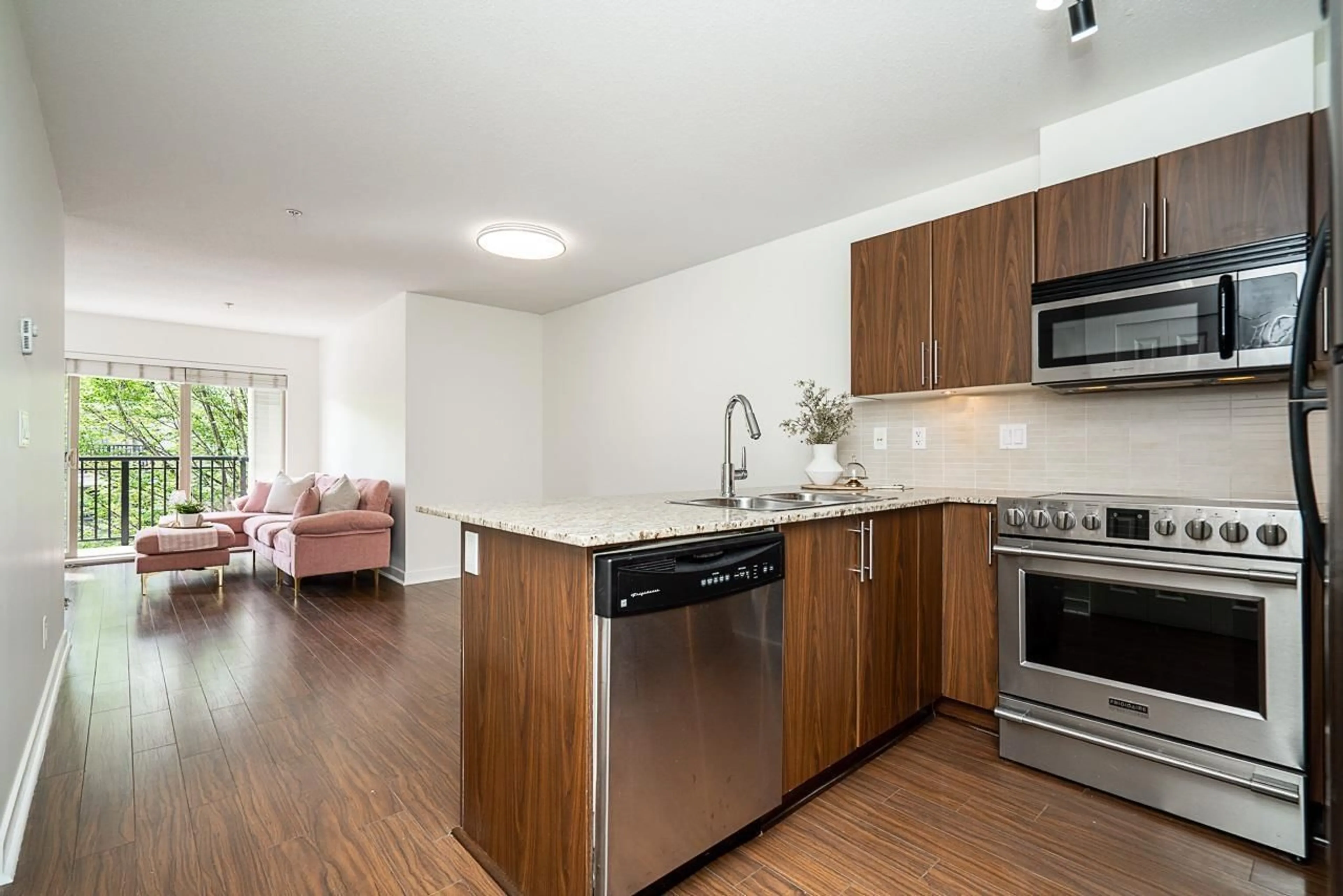 Open concept kitchen, wood/laminate floor for D311 - 8929 202 STREET, Langley British Columbia V1M0B4