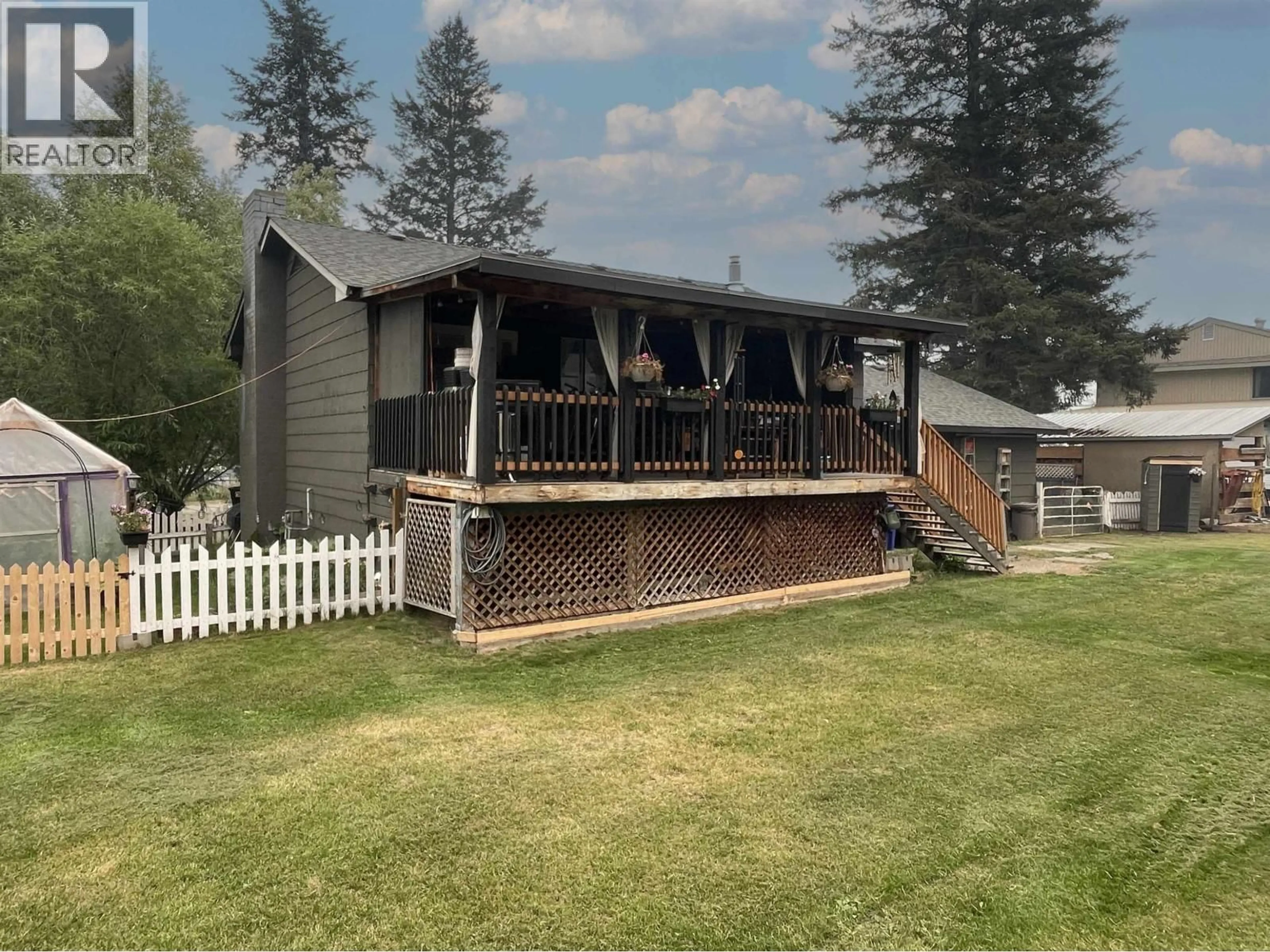 A pic from outside/outdoor area/front of a property/back of a property/a pic from drone, mountain view for 5418 PARK DRIVE, 103 Mile House British Columbia V0K2E1