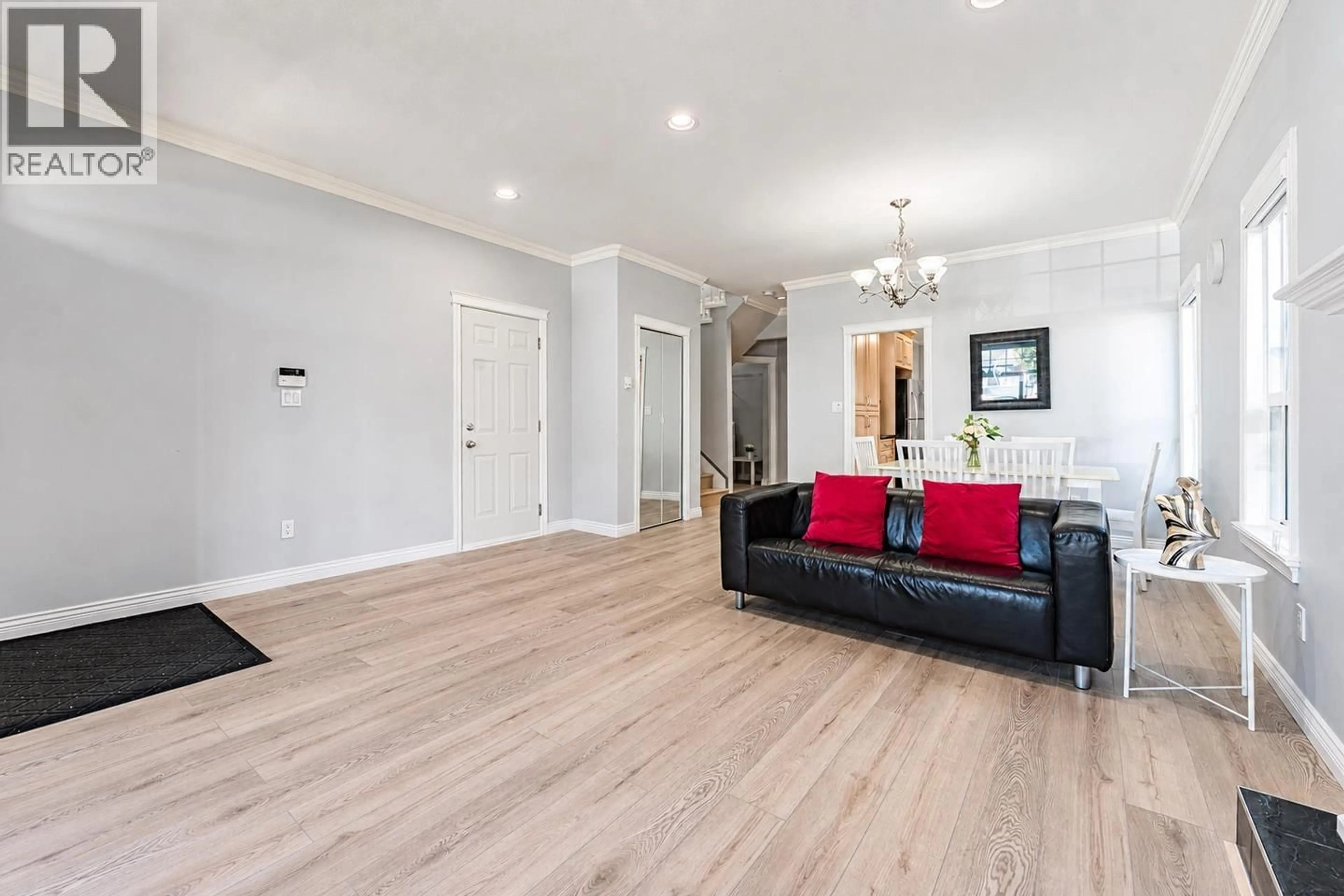 Living room with furniture, wood/laminate floor for 7930 EDMONDS STREET, Burnaby British Columbia V3N1C2