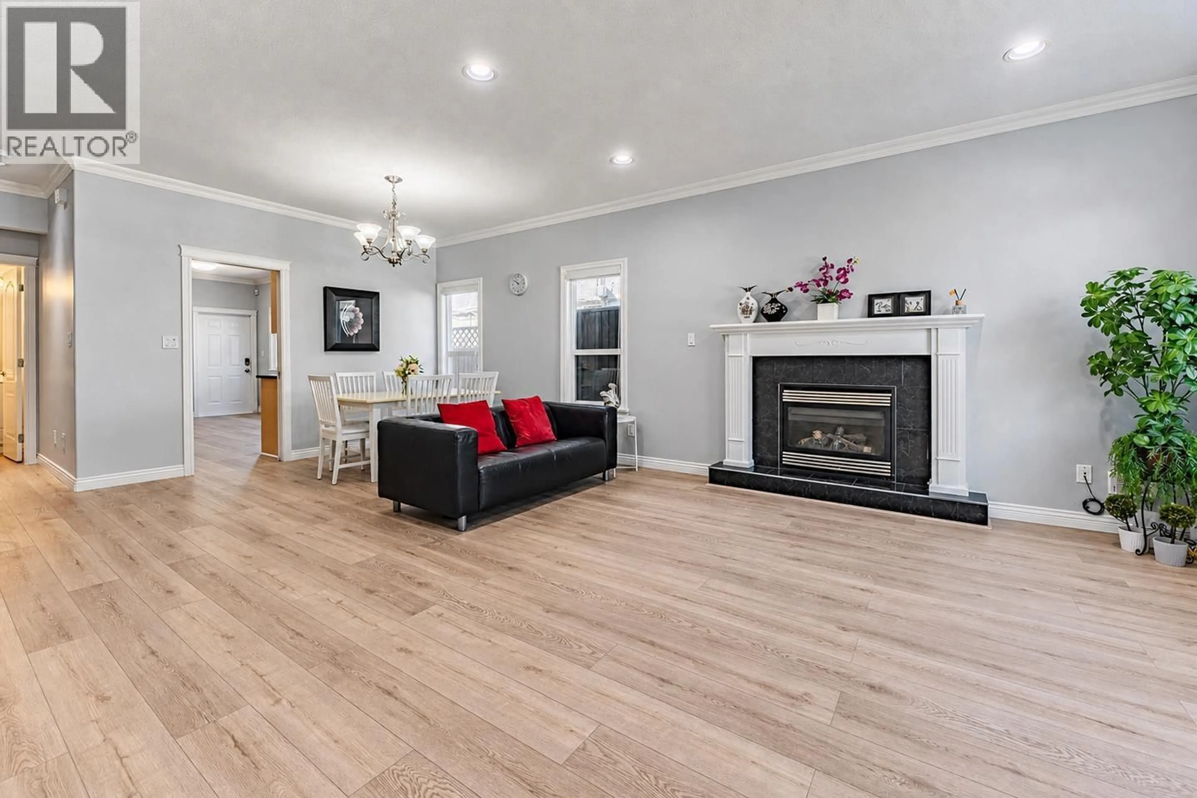 Living room with furniture, wood/laminate floor for 7930 EDMONDS STREET, Burnaby British Columbia V3N1C2