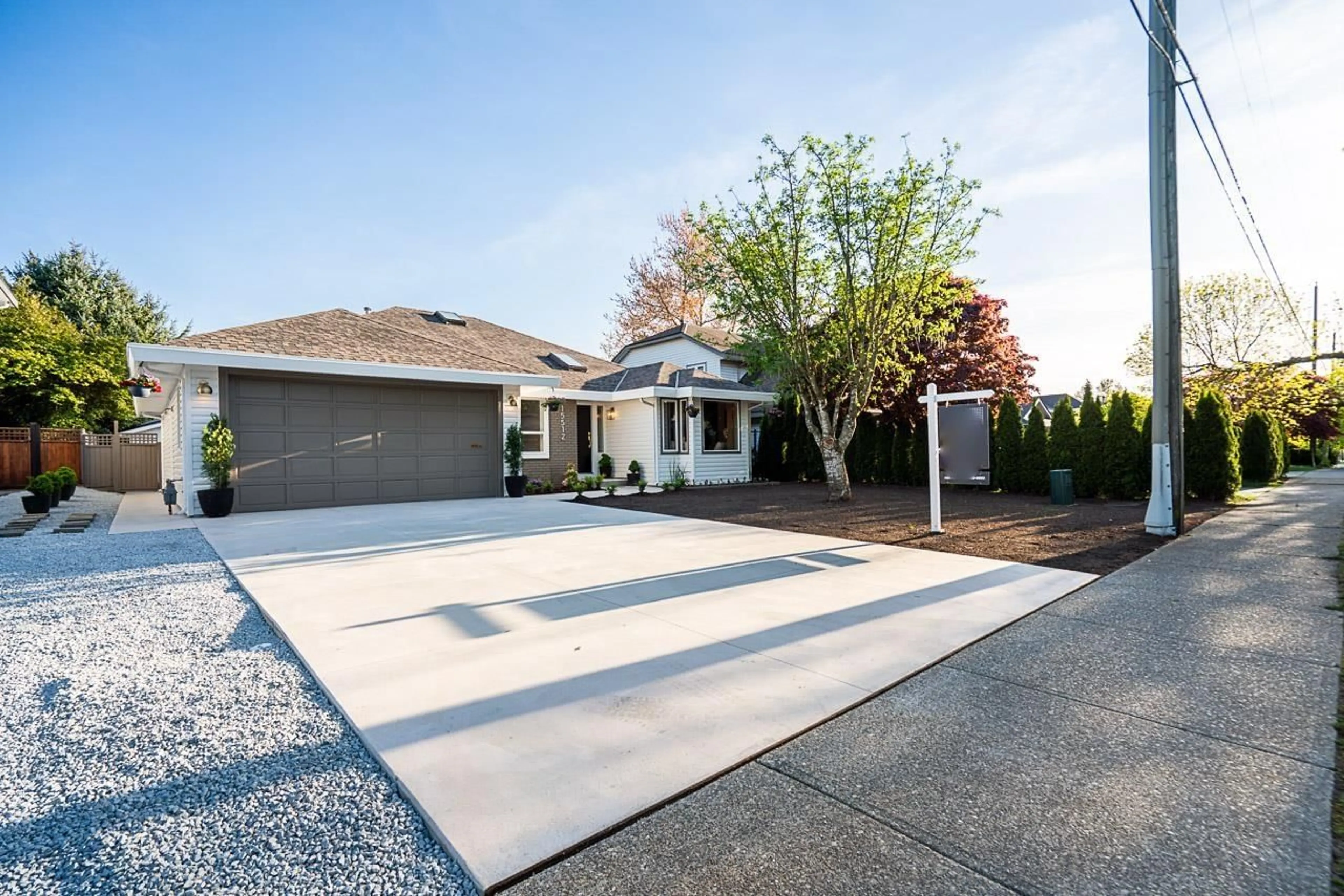 Home with vinyl exterior material, street for 15512 112 AVENUE, Surrey British Columbia V3R6H1