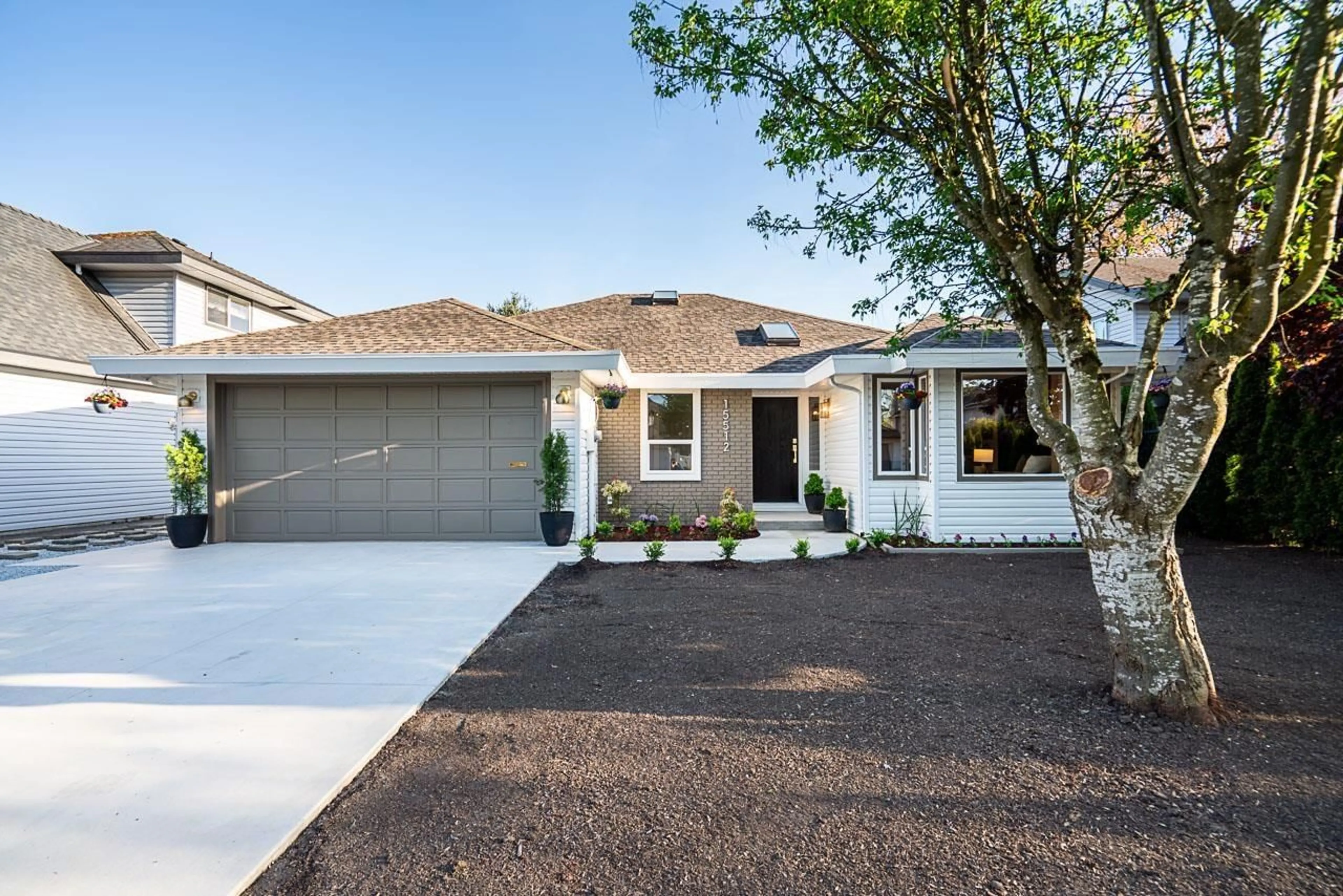 Home with vinyl exterior material, street for 15512 112 AVENUE, Surrey British Columbia V3R6H1