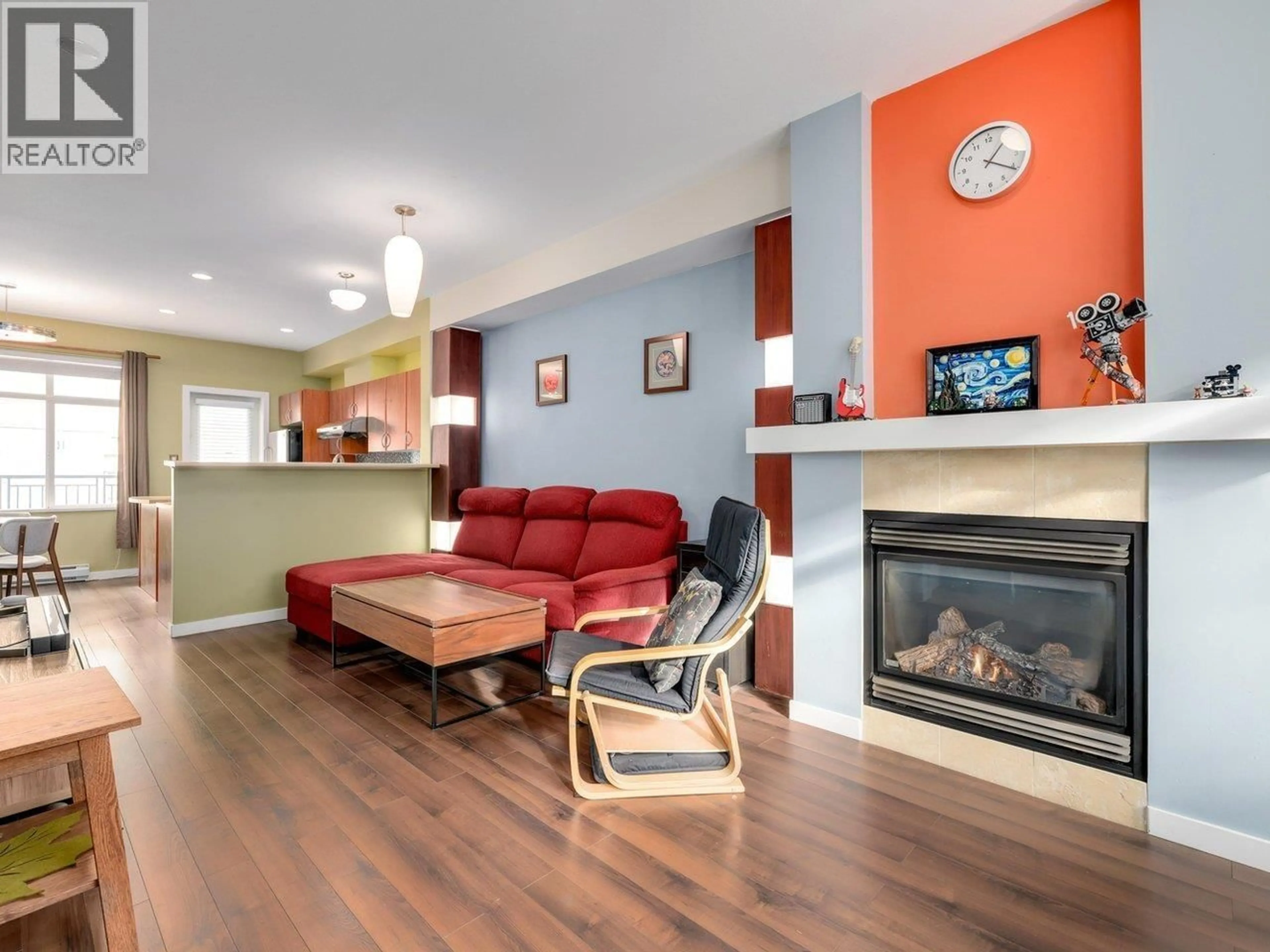 Living room with furniture, wood/laminate floor for 59 - 6528 DENBIGH AVENUE, Burnaby British Columbia V5H3R8