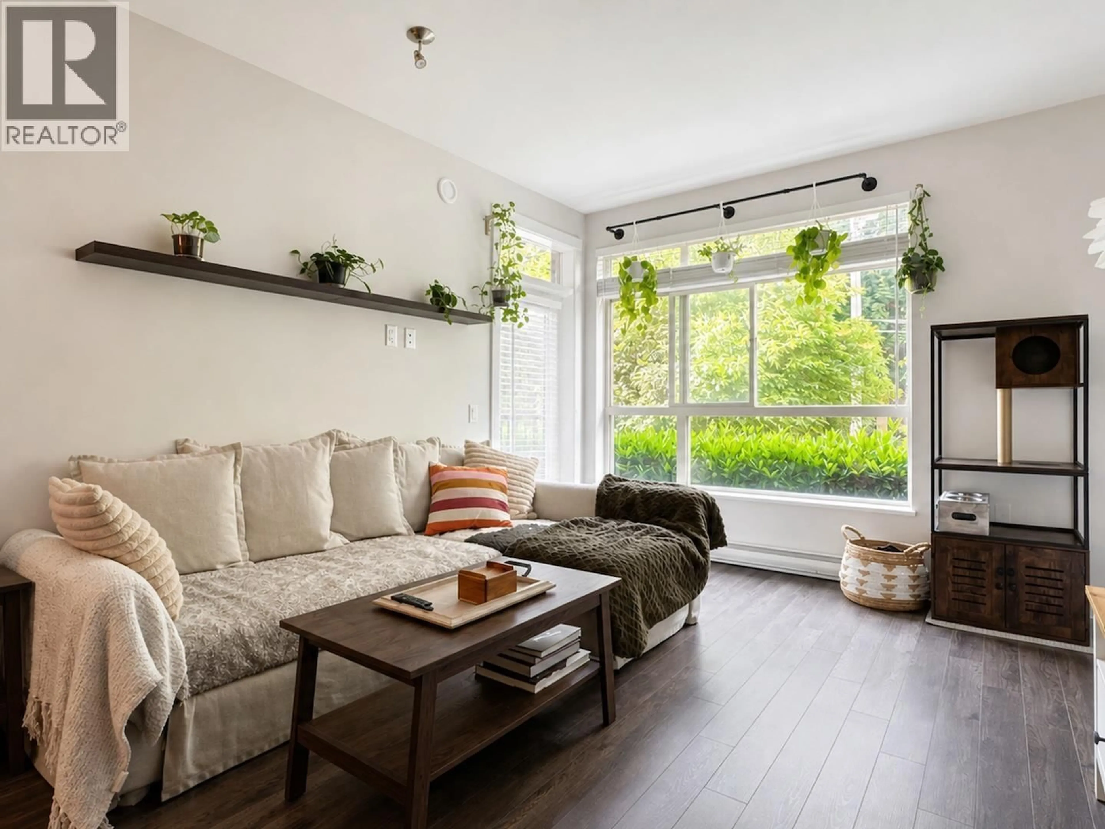Living room with furniture, wood/laminate floor for 102 - 2436 KELLY AVENUE, Port Coquitlam British Columbia V3C0G9