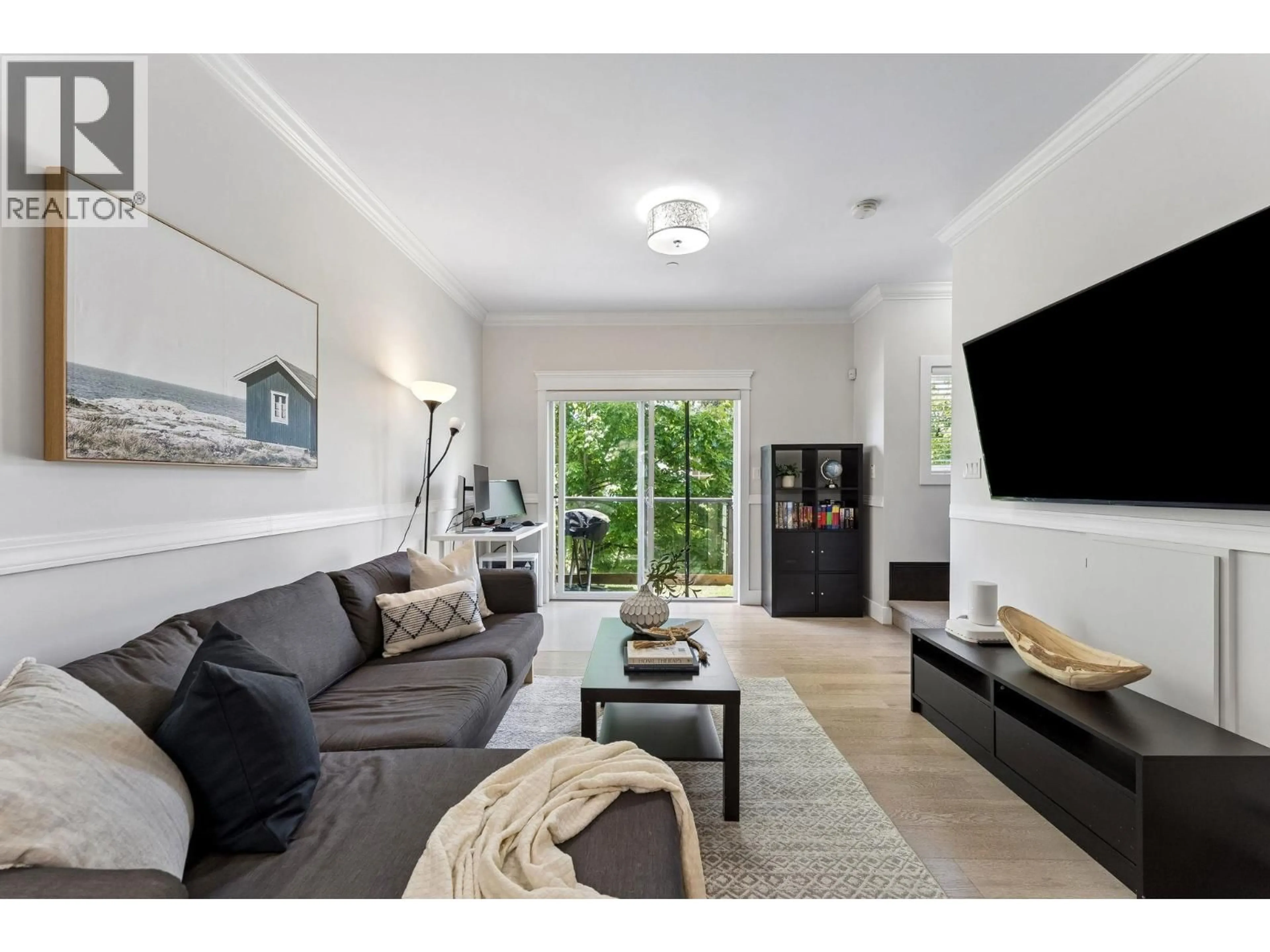 Living room with furniture, unknown for 203 - 3488 SEFTON STREET, Port Coquitlam British Columbia V3B3R2