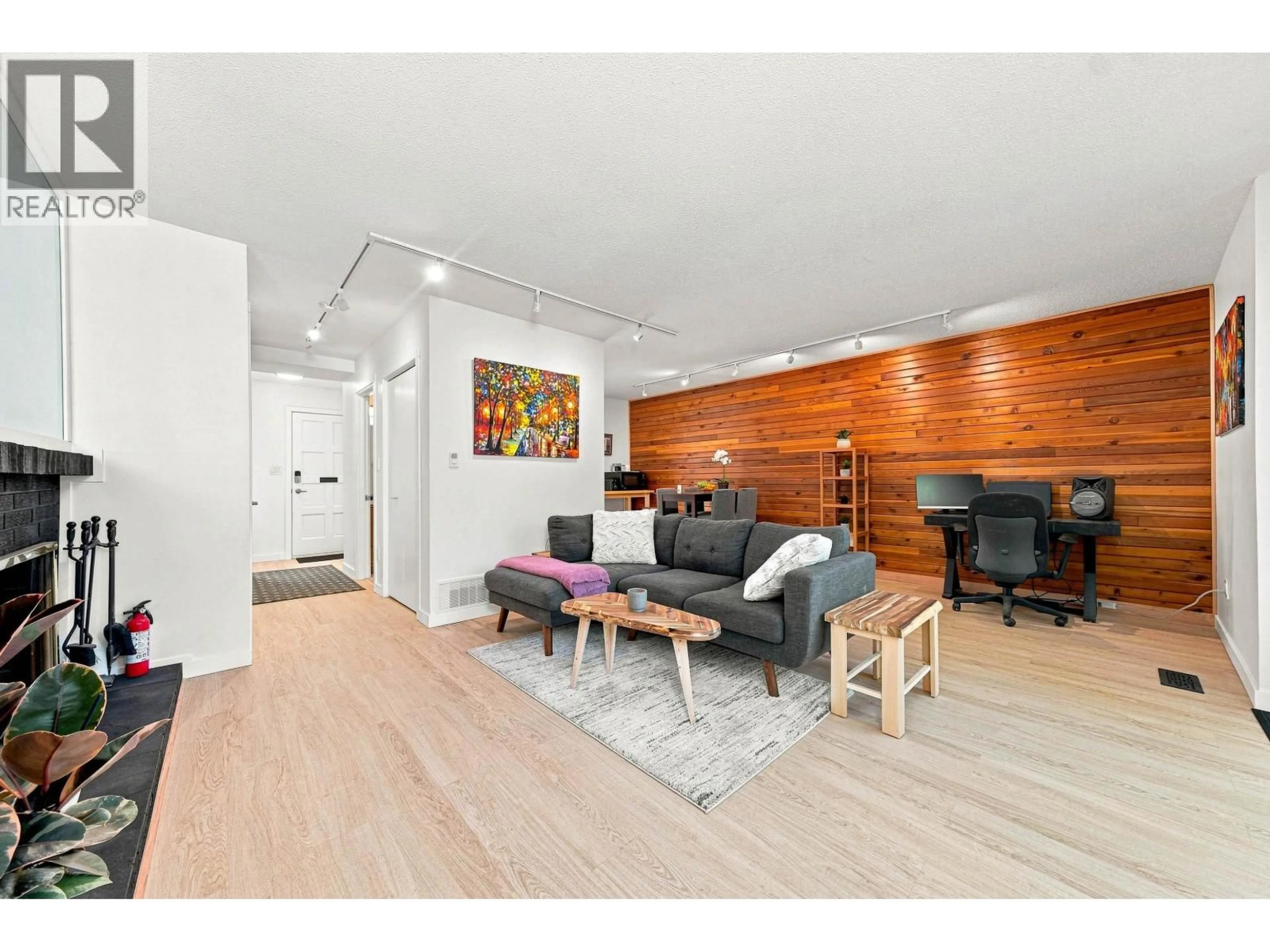 Living room with furniture, wood/laminate floor for 877 OLD LILLOOET ROAD, North Vancouver British Columbia V7J2H6