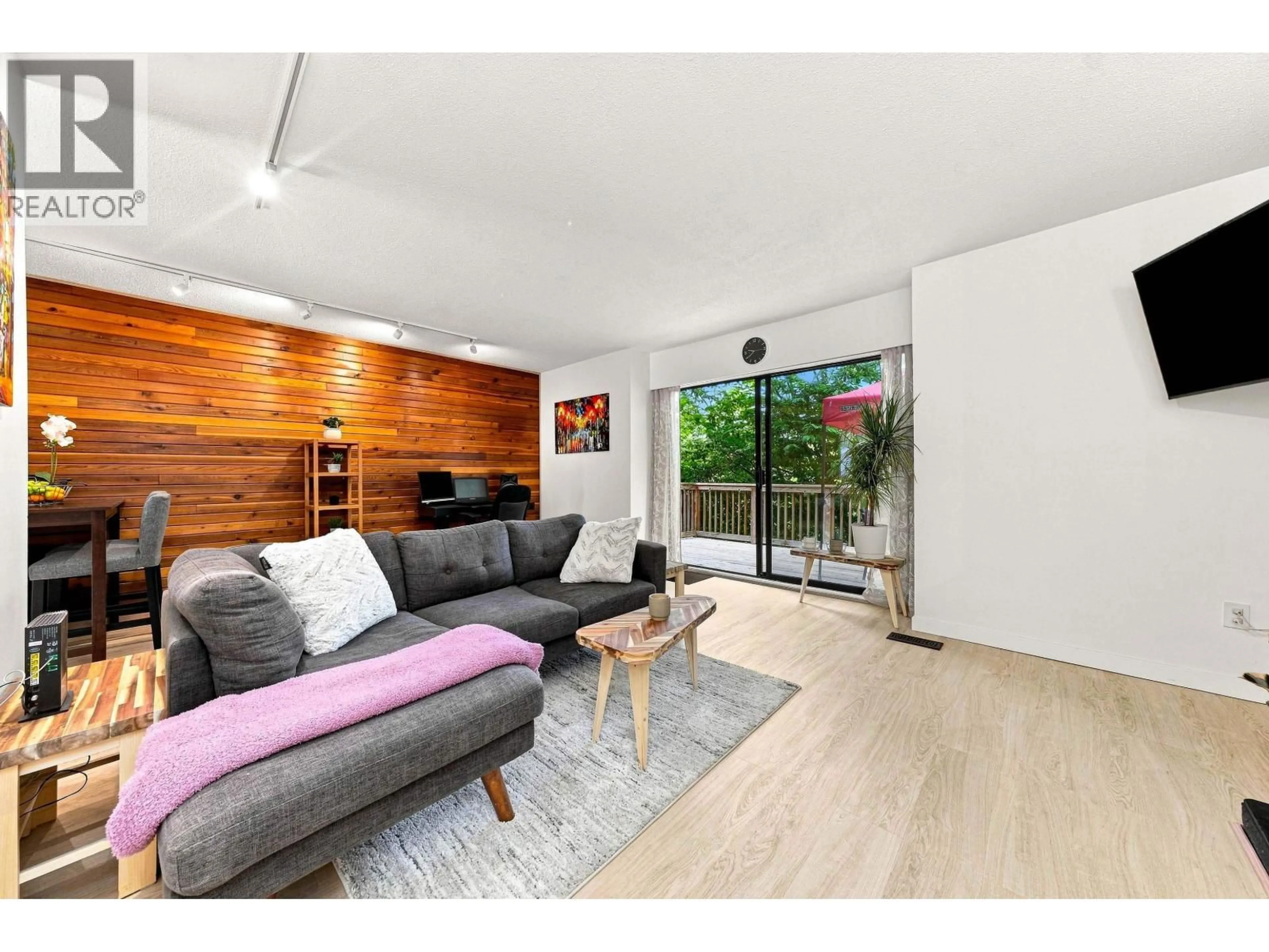 Living room with furniture, wood/laminate floor for 877 OLD LILLOOET ROAD, North Vancouver British Columbia V7J2H6
