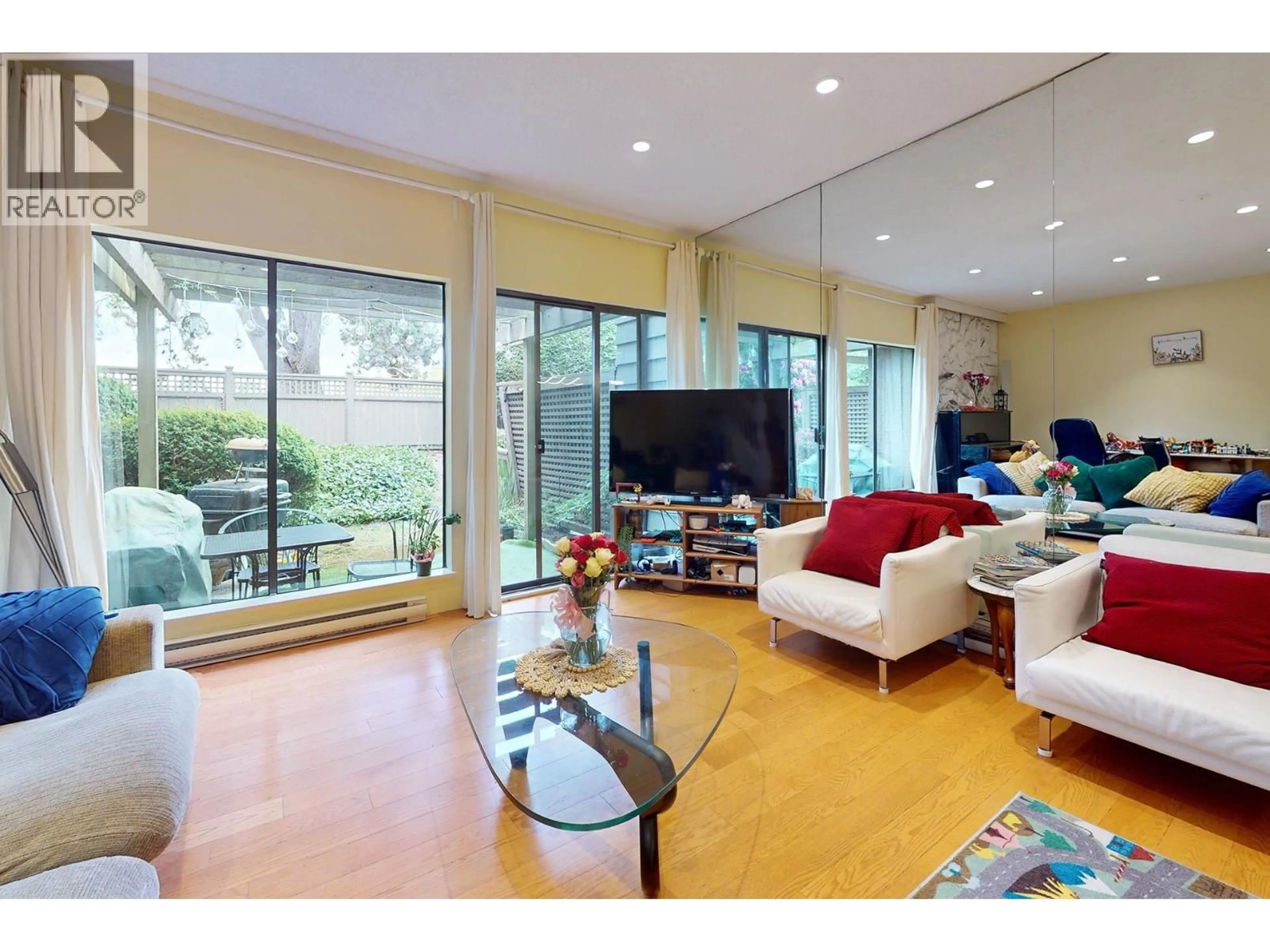 Living room with furniture, wood/laminate floor for 18 - 10391 NO. 3 ROAD, Richmond British Columbia V7A4V2