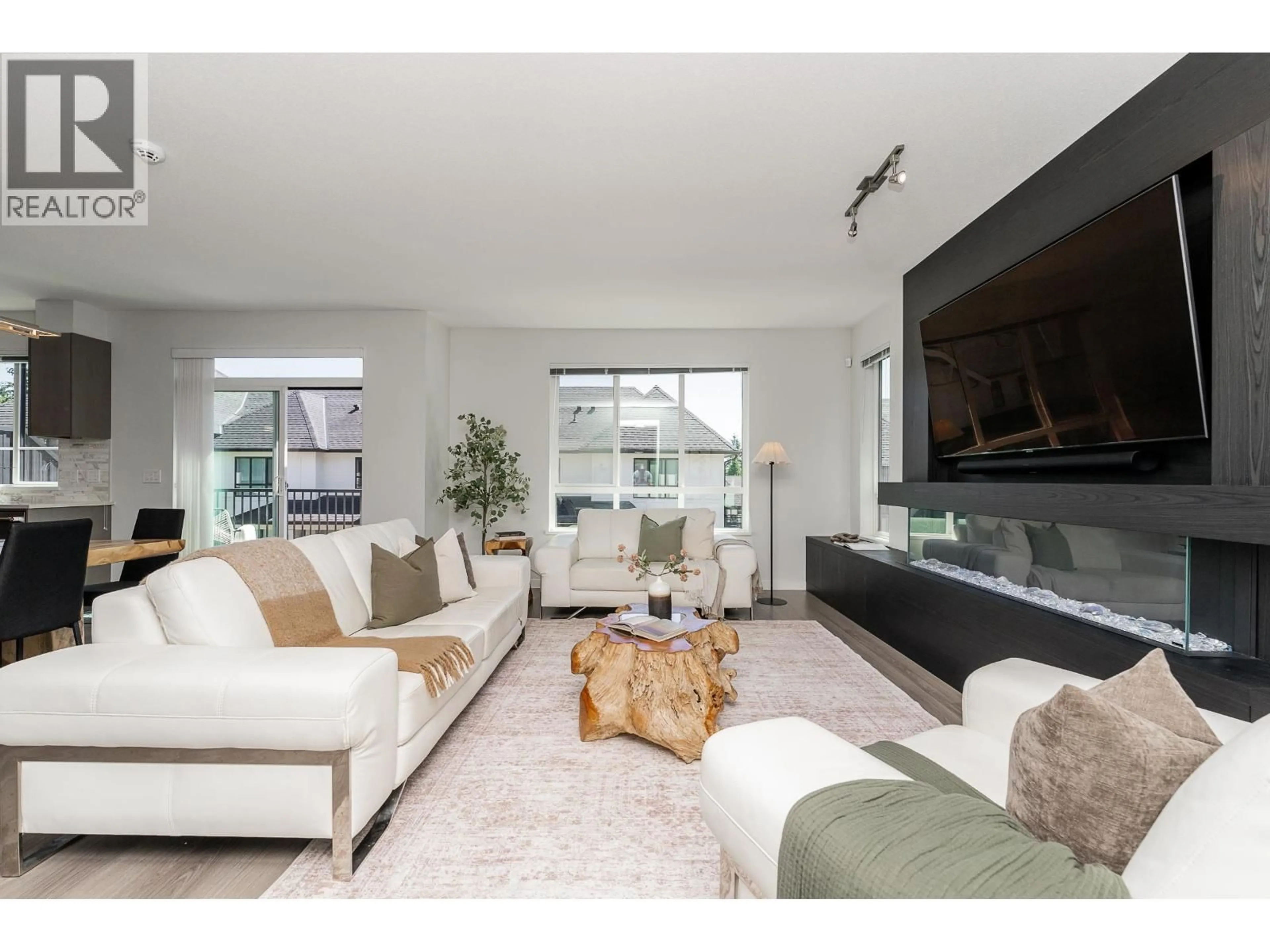 Living room with furniture, unknown for 108 - 3500 BURKE VILLAGE PROMENADE, Coquitlam British Columbia V3E0N2