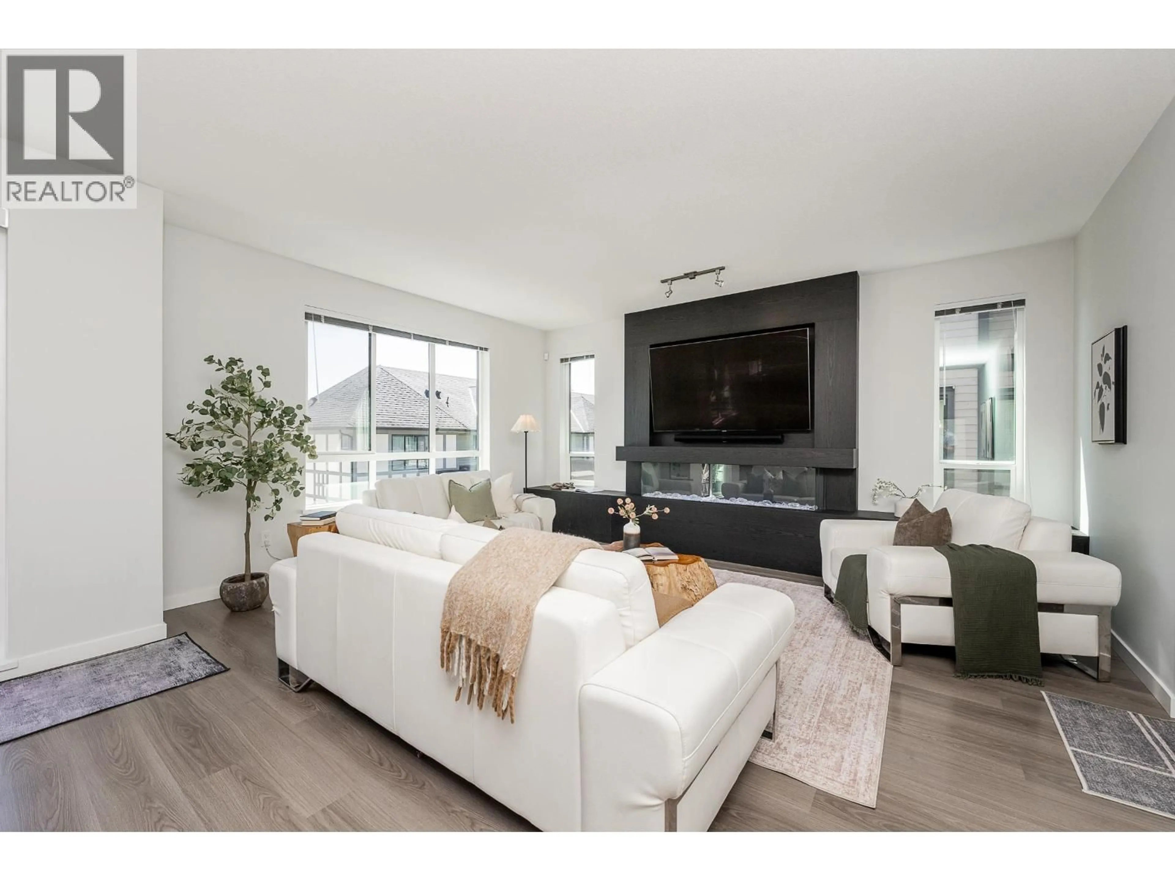 Living room with furniture, unknown for 108 - 3500 BURKE VILLAGE PROMENADE, Coquitlam British Columbia V3E0N2