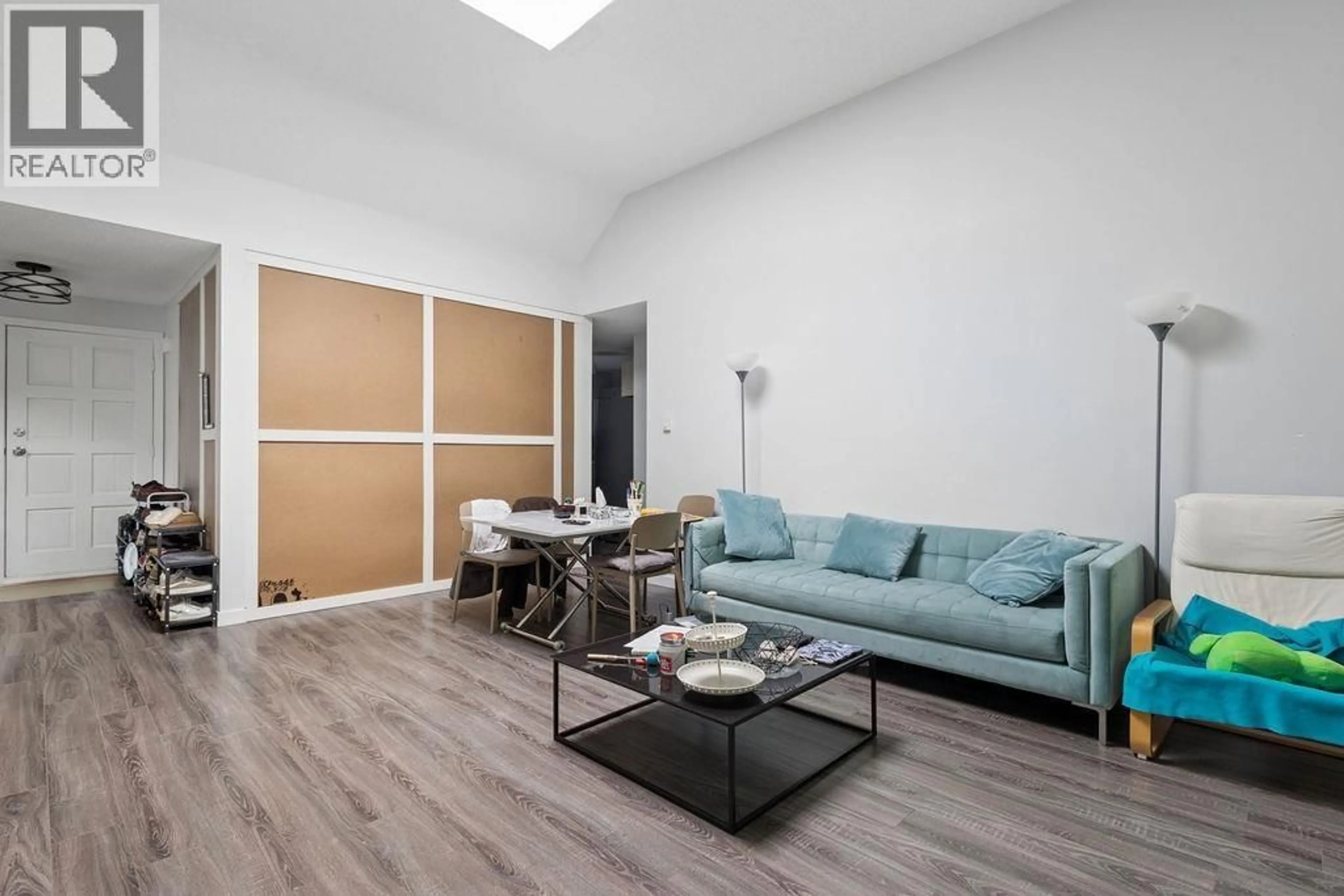 Living room with furniture, wood/laminate floor for 311 - 444 49TH AVENUE, Vancouver British Columbia V5Y3V4