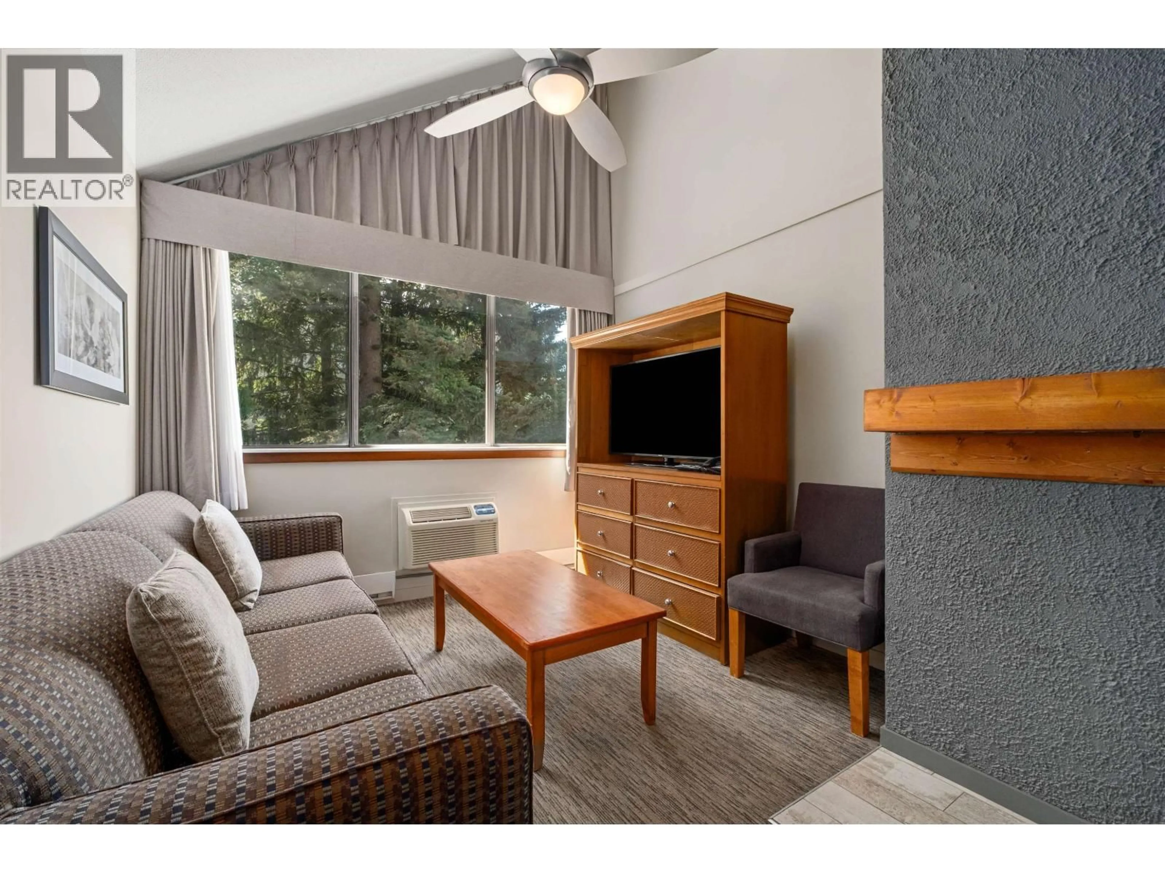 Living room with furniture, wood/laminate floor for 360 - 4429 SUNDIAL PLACE, Whistler British Columbia V8E1G8