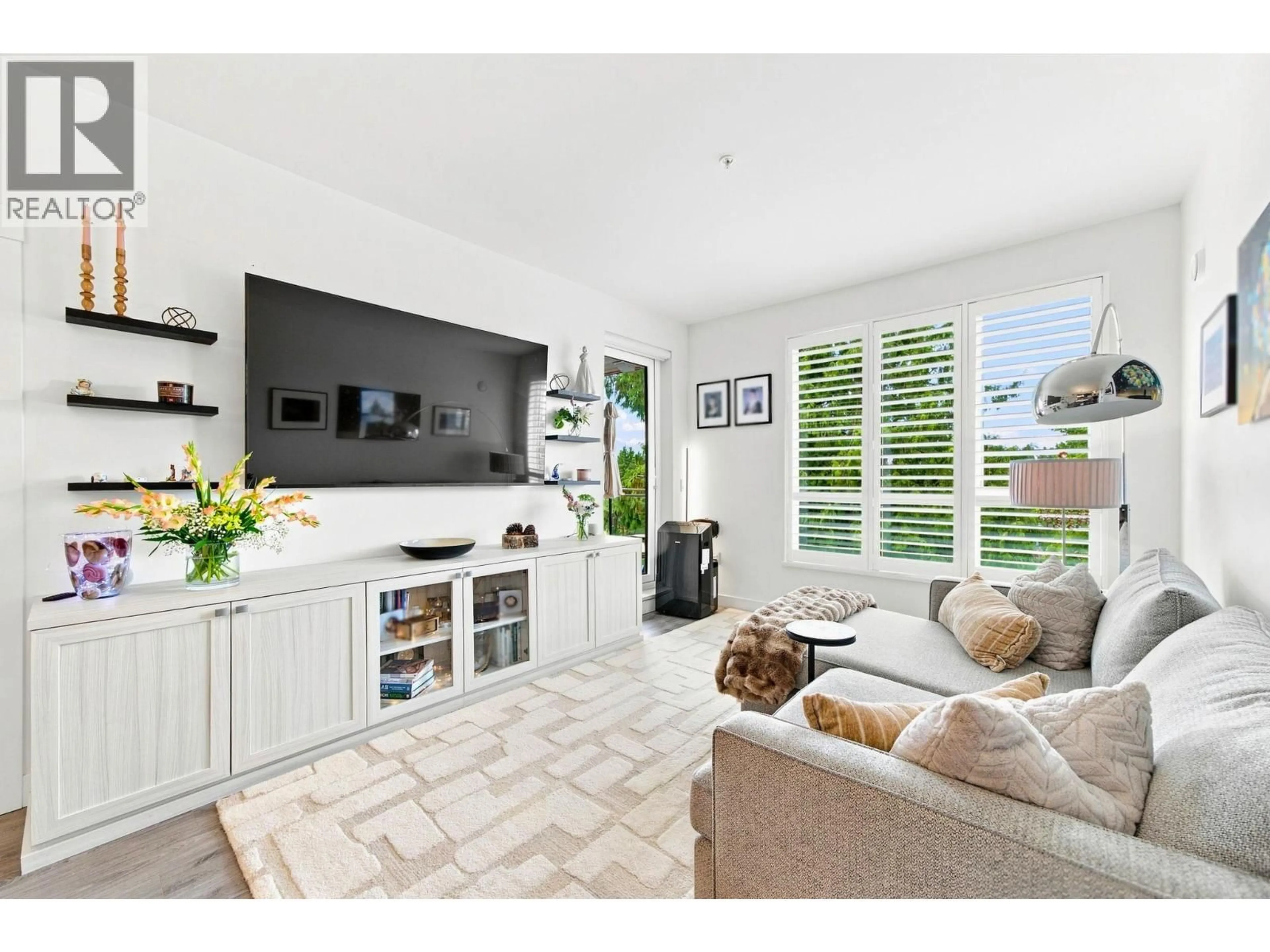 Living room with furniture, ceramic/tile floor for 401 - 1327 DRAYCOTT ROAD, North Vancouver British Columbia V7J1W1