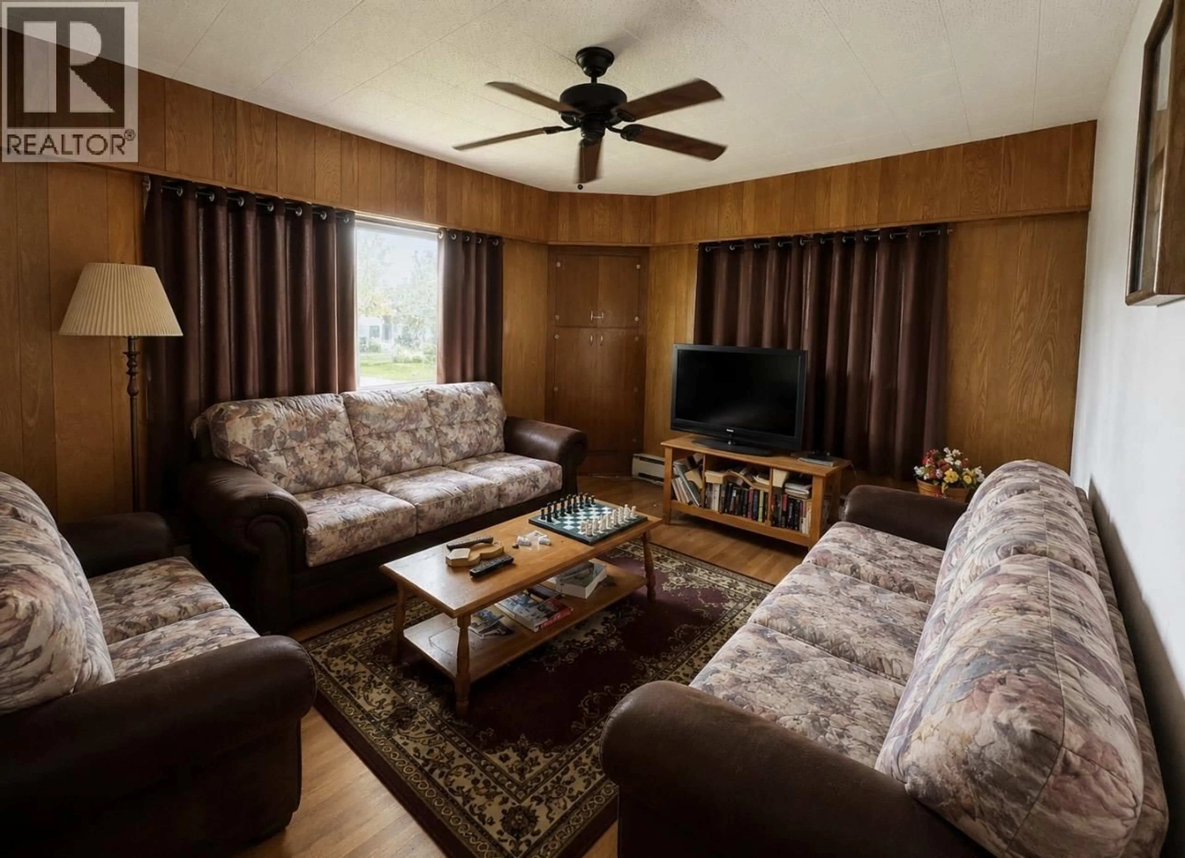 Living room with furniture, wood/laminate floor for 1640 8TH AVENUE, Prince George British Columbia V2L3R5
