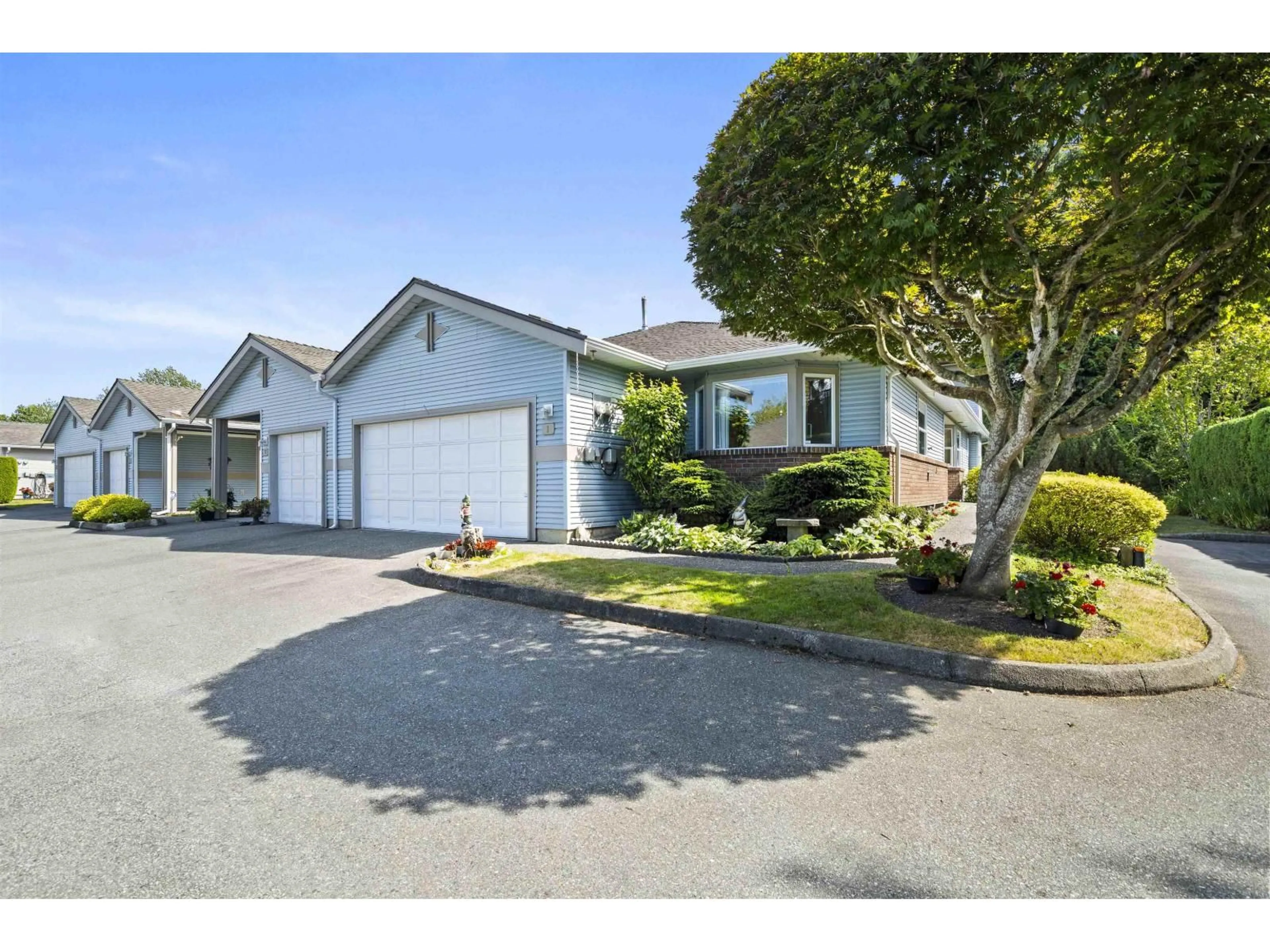 A pic from outside/outdoor area/front of a property/back of a property/a pic from drone, street for 1 - 8889 212 STREET, Langley British Columbia V1M2E8