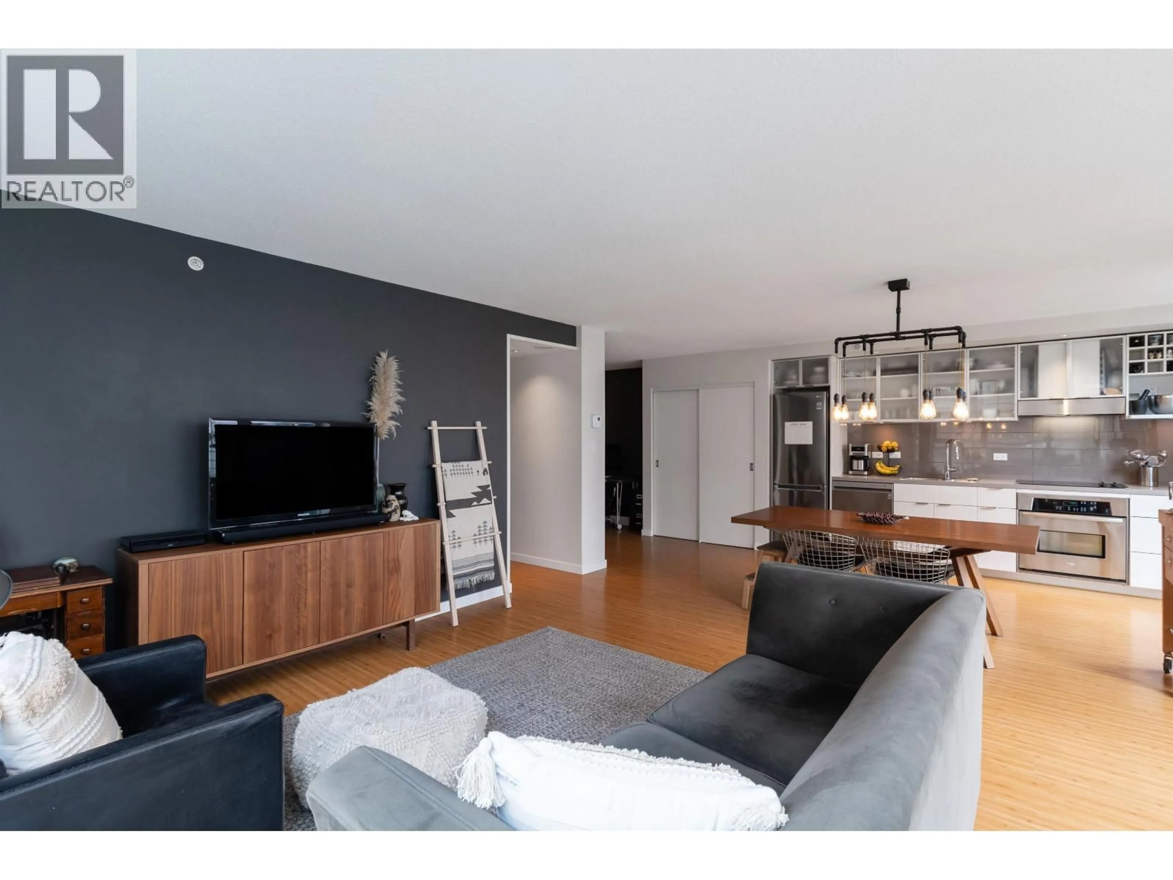 Living room with furniture, wood/laminate floor for 601 - 168 POWELL STREET, Vancouver British Columbia V6A0B2