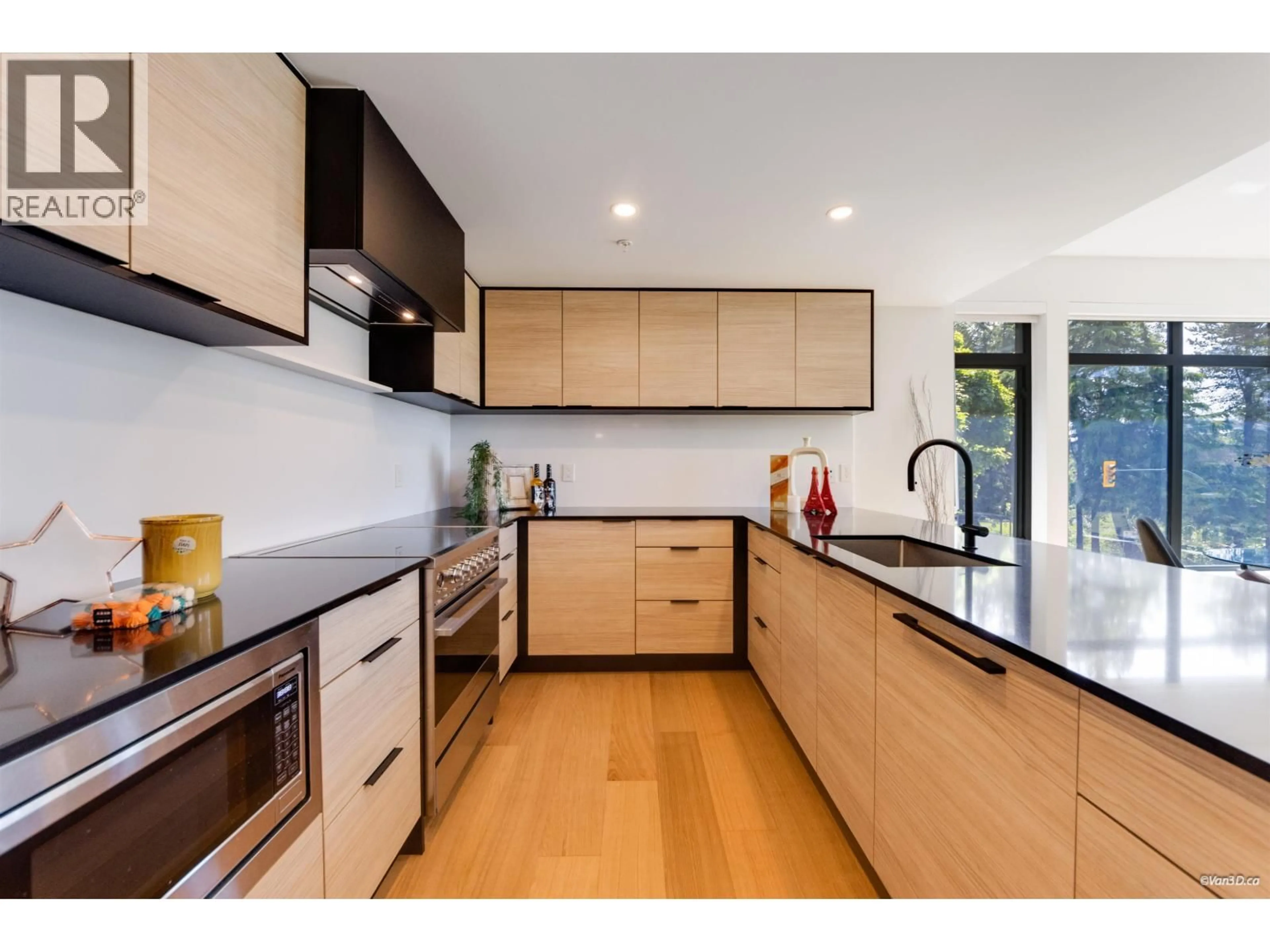 Contemporary kitchen, wood/laminate floor for 302 - 6485 MANITOBA STREET, Vancouver British Columbia V5Y0P7