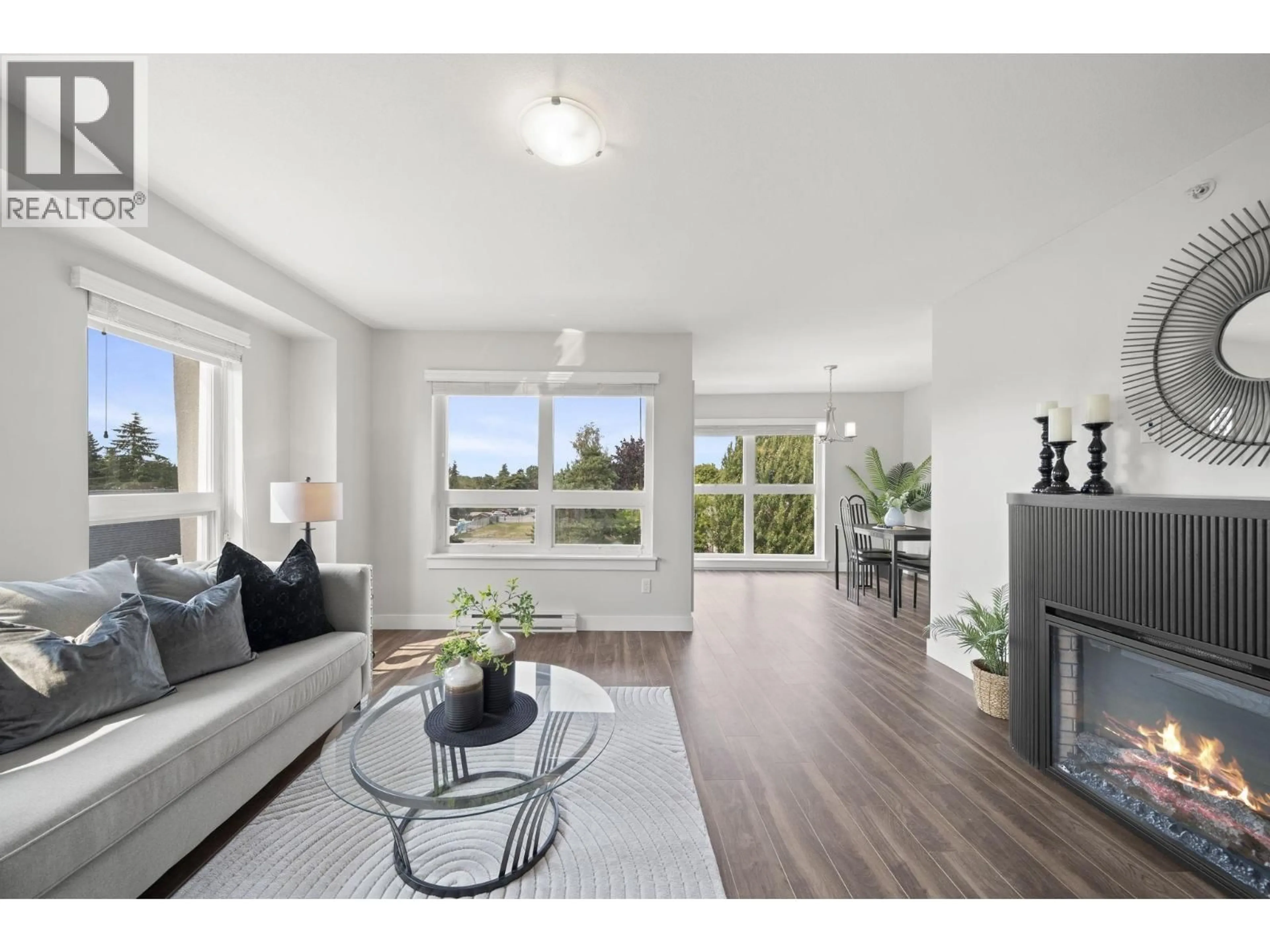 Living room with furniture, wood/laminate floor for 306 - 4815 55B STREET, Delta British Columbia V4K3V7