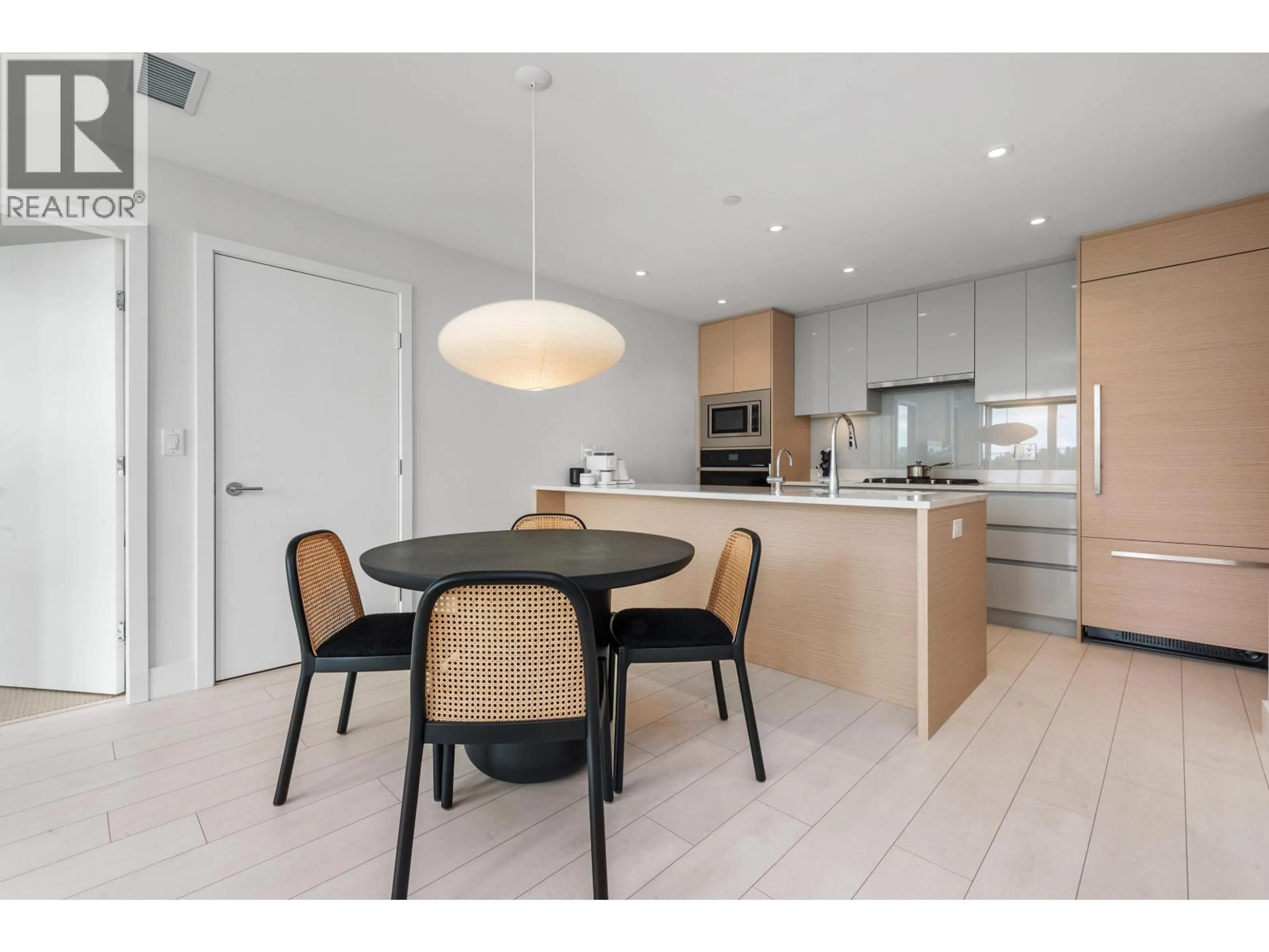 Open concept kitchen, wood/laminate floor for 560 - 8575 RIVERGRASS DRIVE, Vancouver British Columbia V5S0J7