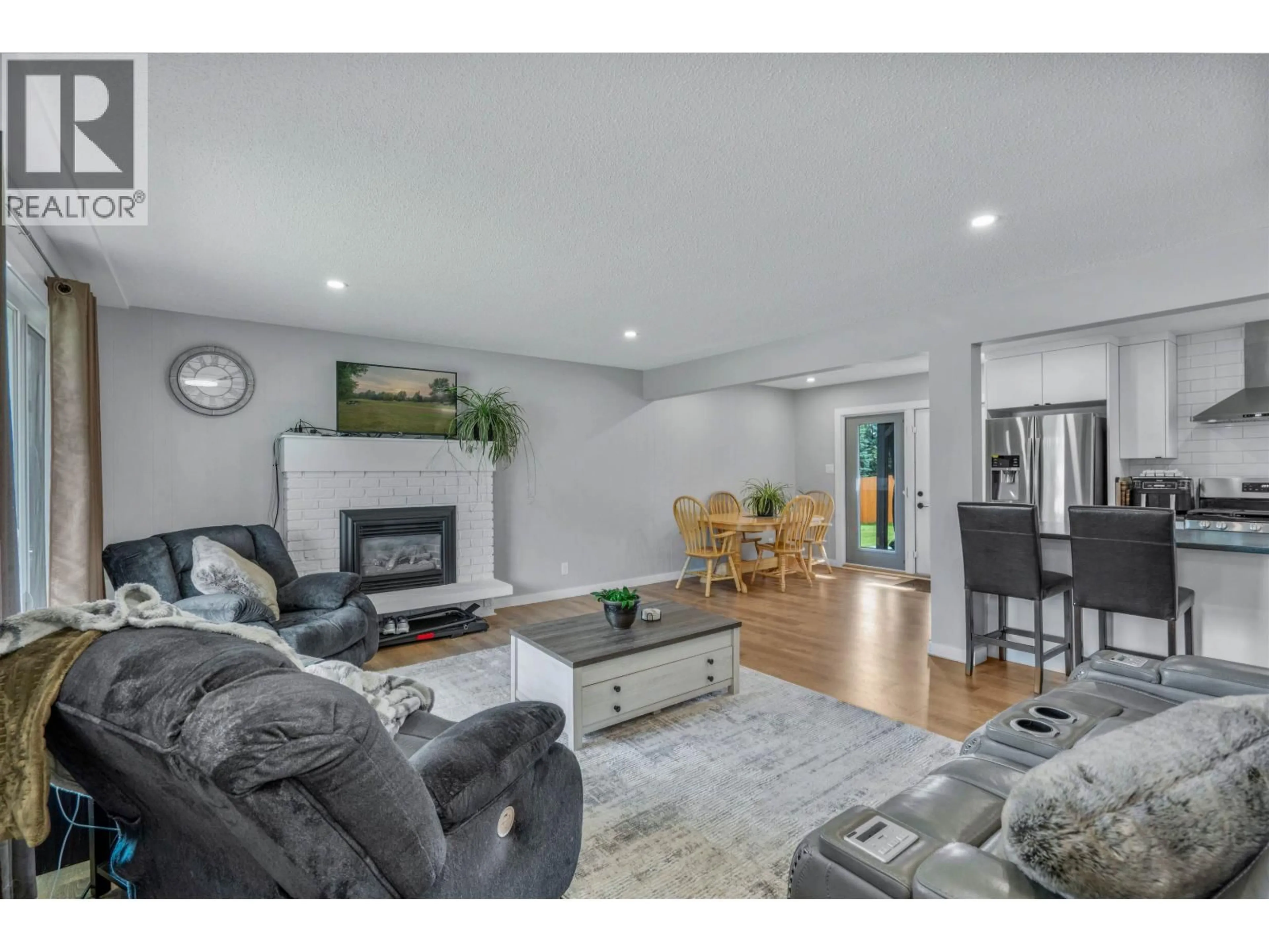 Living room with furniture, wood/laminate floor for 5932 MONTGOMERY CRESCENT, Prince George British Columbia V2K2E2