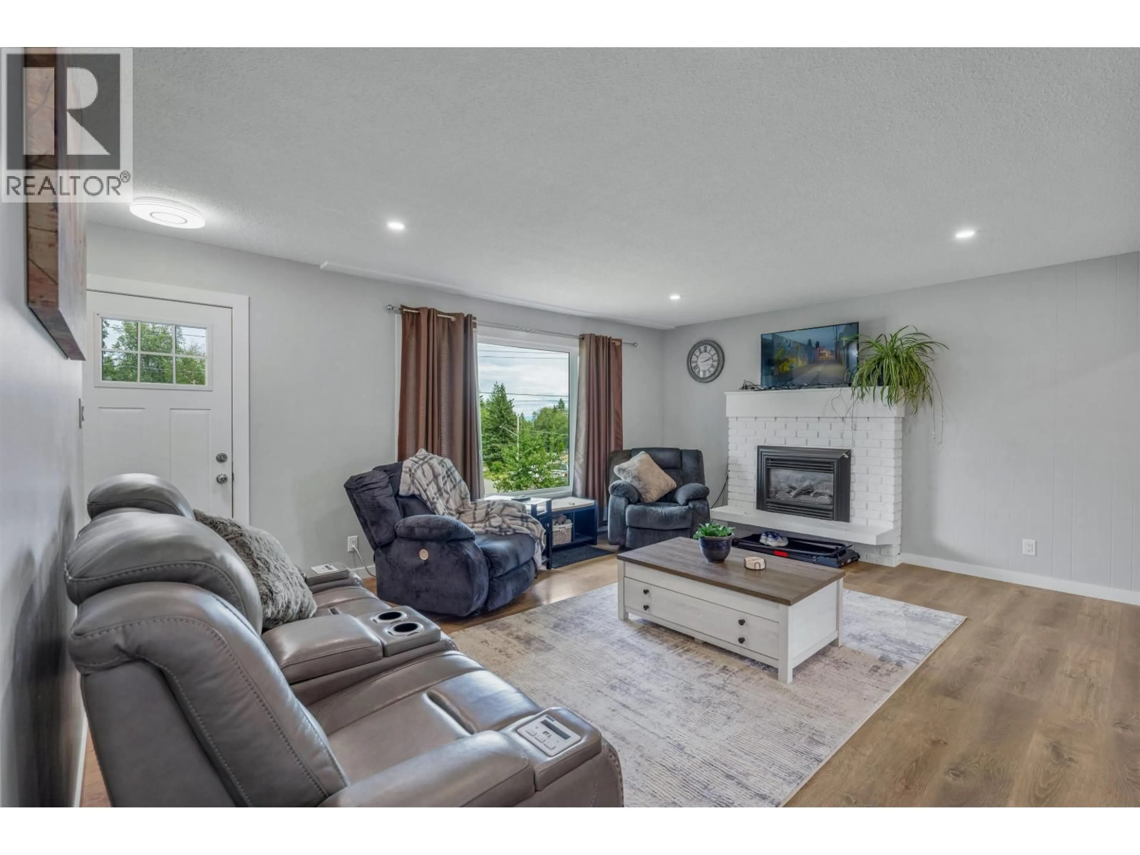 Living room with furniture, wood/laminate floor for 5932 MONTGOMERY CRESCENT, Prince George British Columbia V2K2E2
