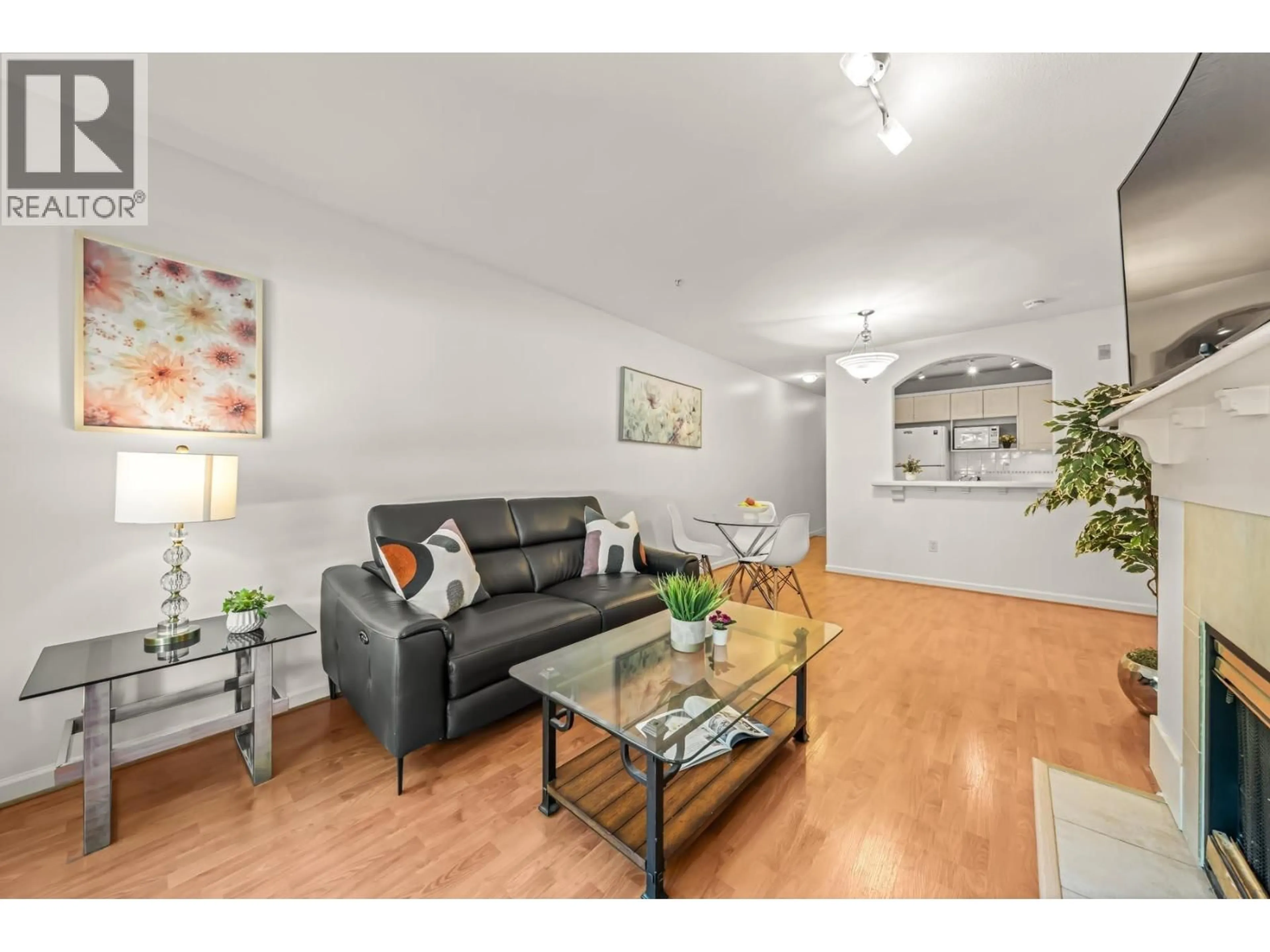 Living room with furniture, wood/laminate floor for 205 - 5900 DOVER CRESCENT, Richmond British Columbia V7C5R4