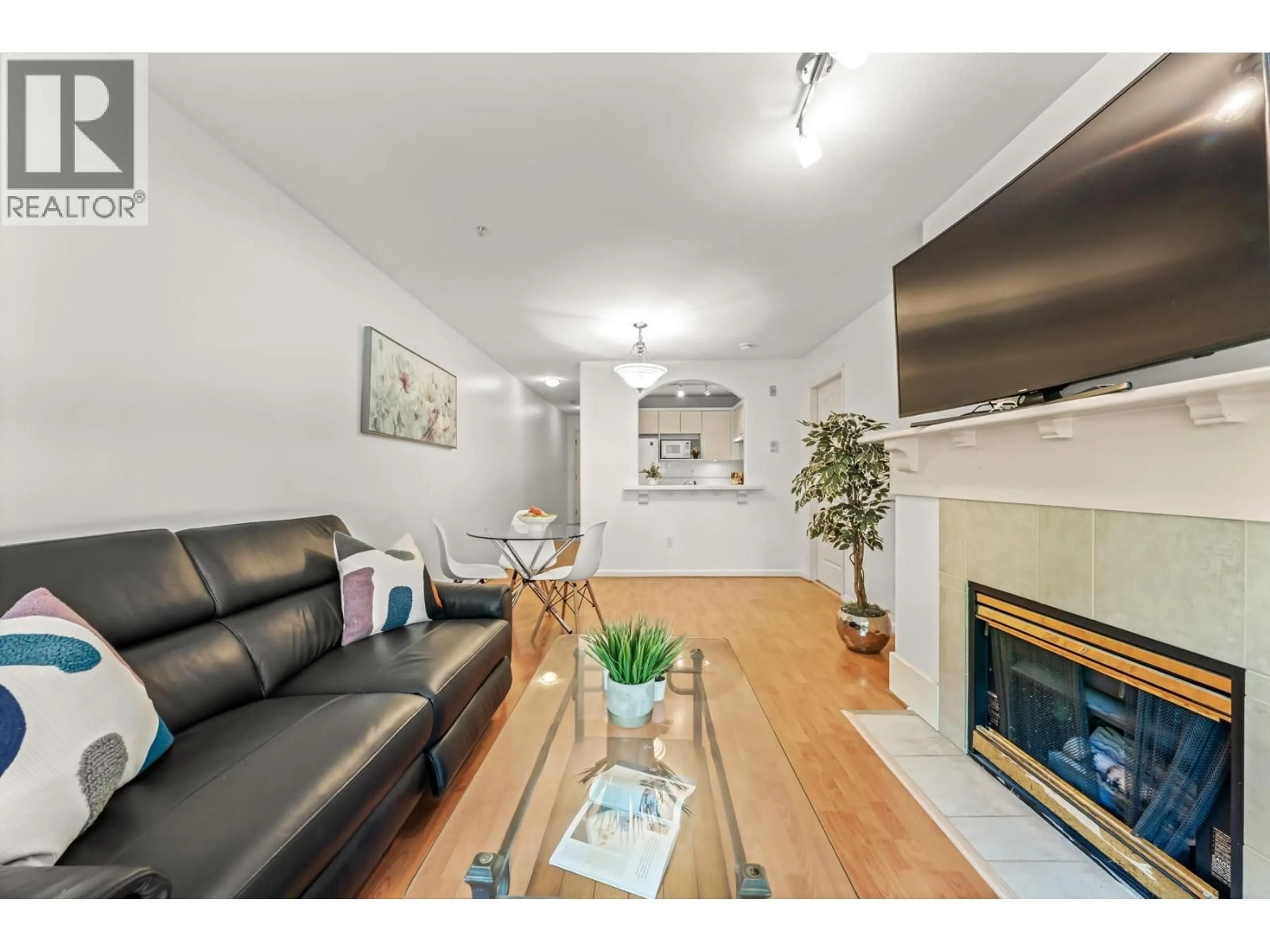 Living room with furniture, wood/laminate floor for 205 - 5900 DOVER CRESCENT, Richmond British Columbia V7C5R4