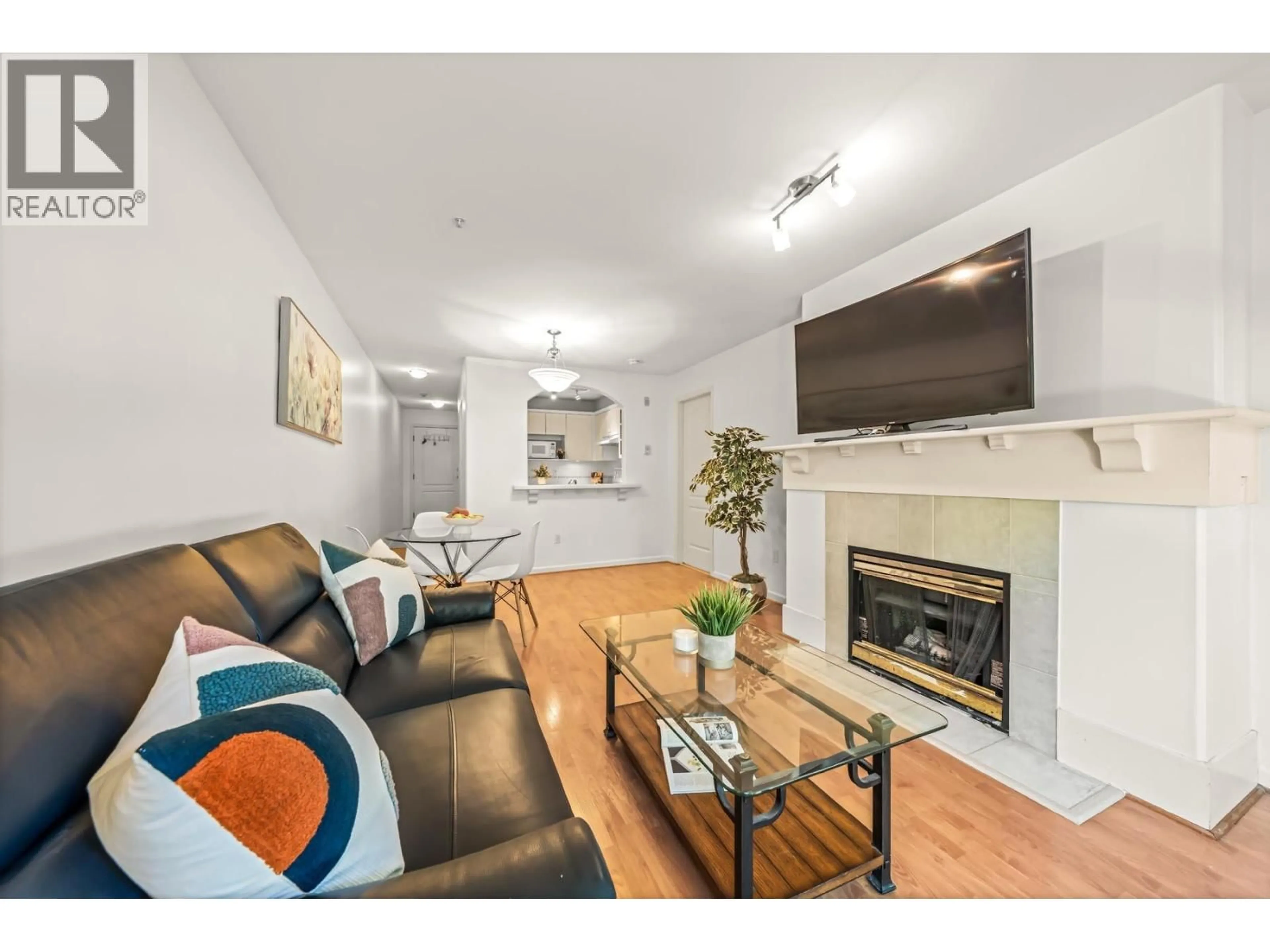 Living room with furniture, wood/laminate floor for 205 - 5900 DOVER CRESCENT, Richmond British Columbia V7C5R4