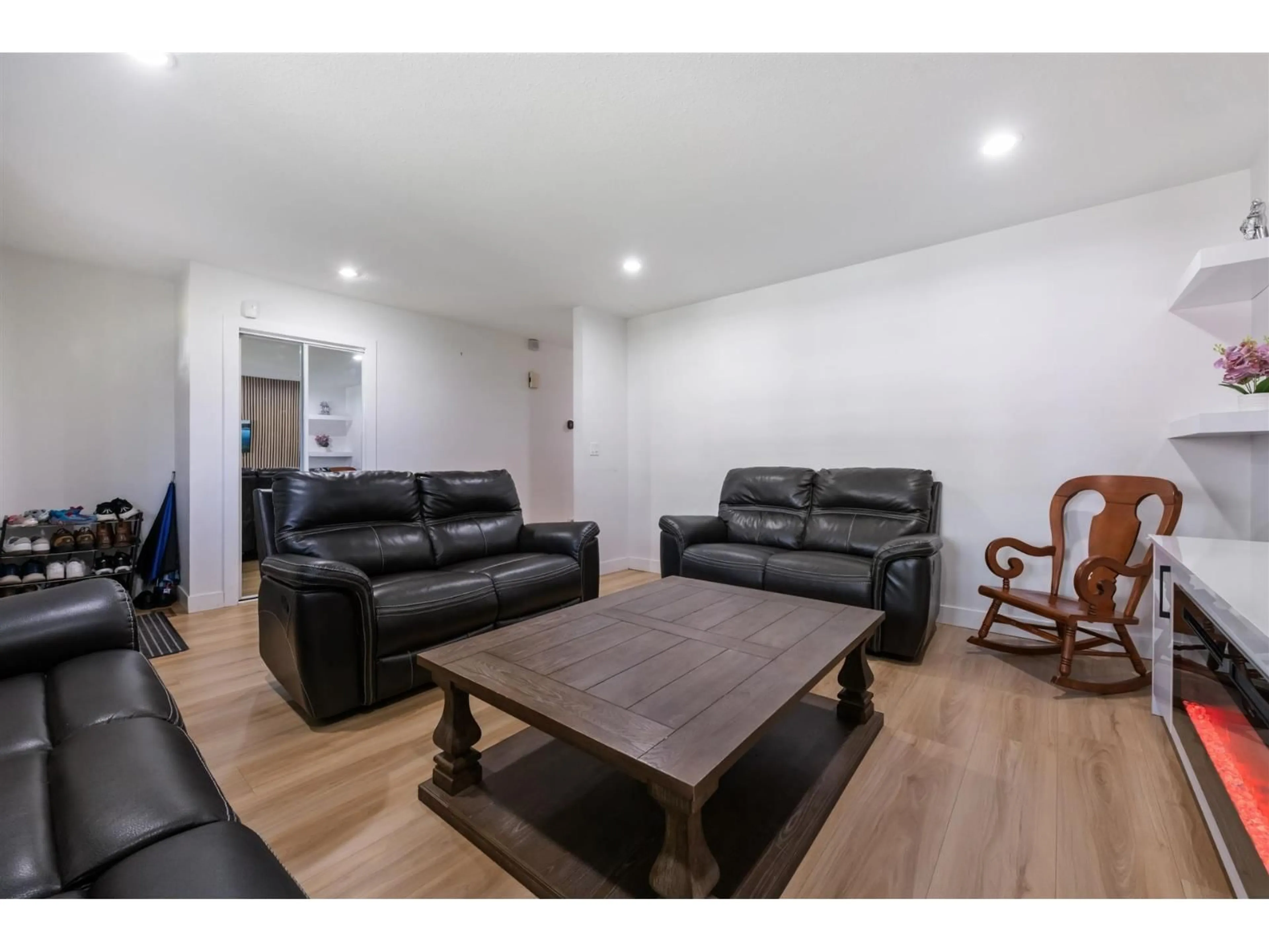 Living room with furniture, wood/laminate floor for 16954 60 AVENUE, Surrey British Columbia V3S1T2