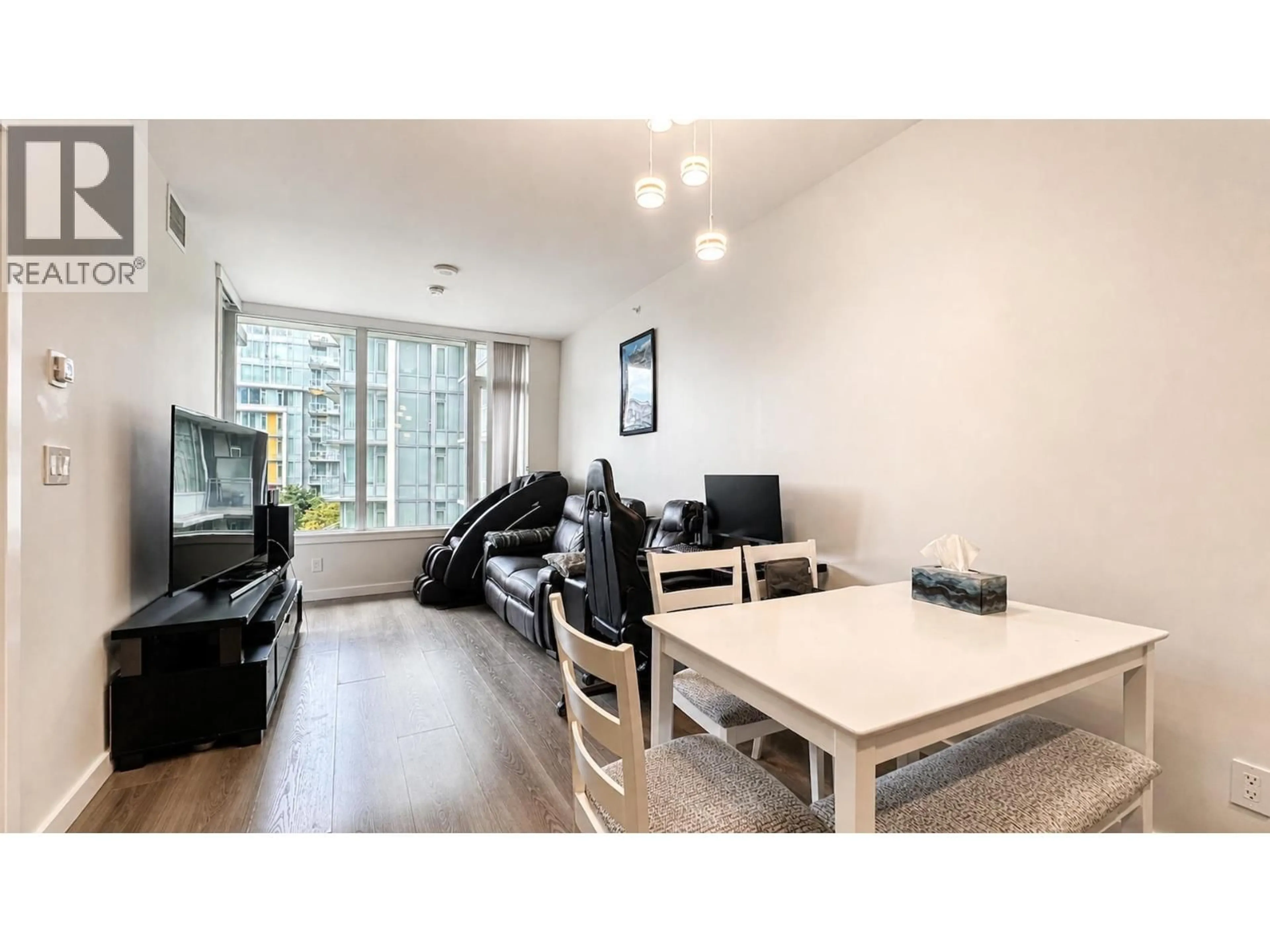 Living room with furniture, wood/laminate floor for 703 - 3333 SEXSMITH ROAD, Richmond British Columbia V6X0R7