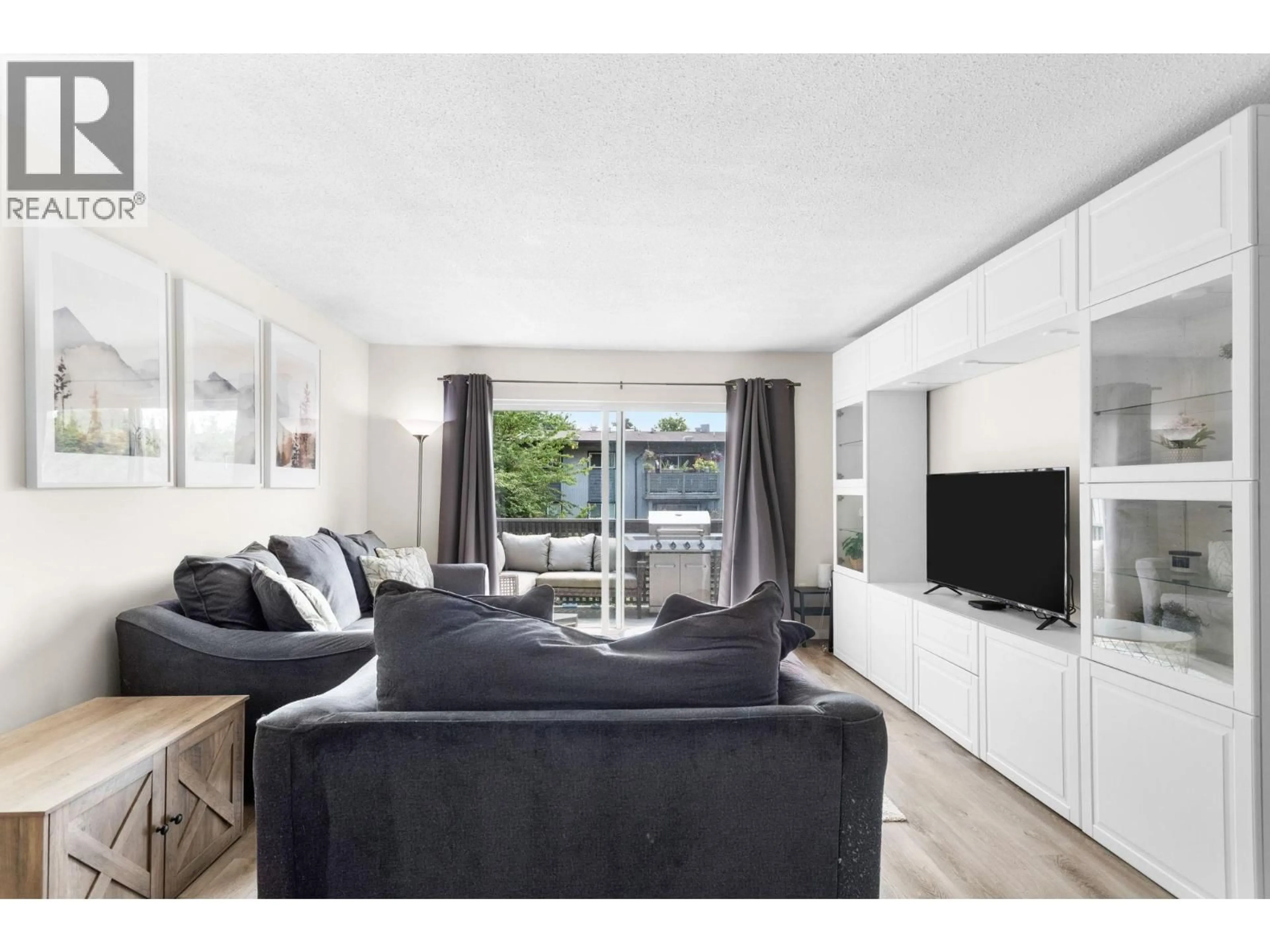 Living room with furniture, wood/laminate floor for 239 - 202 WESTHILL PLACE, Port Moody British Columbia V3H1V2