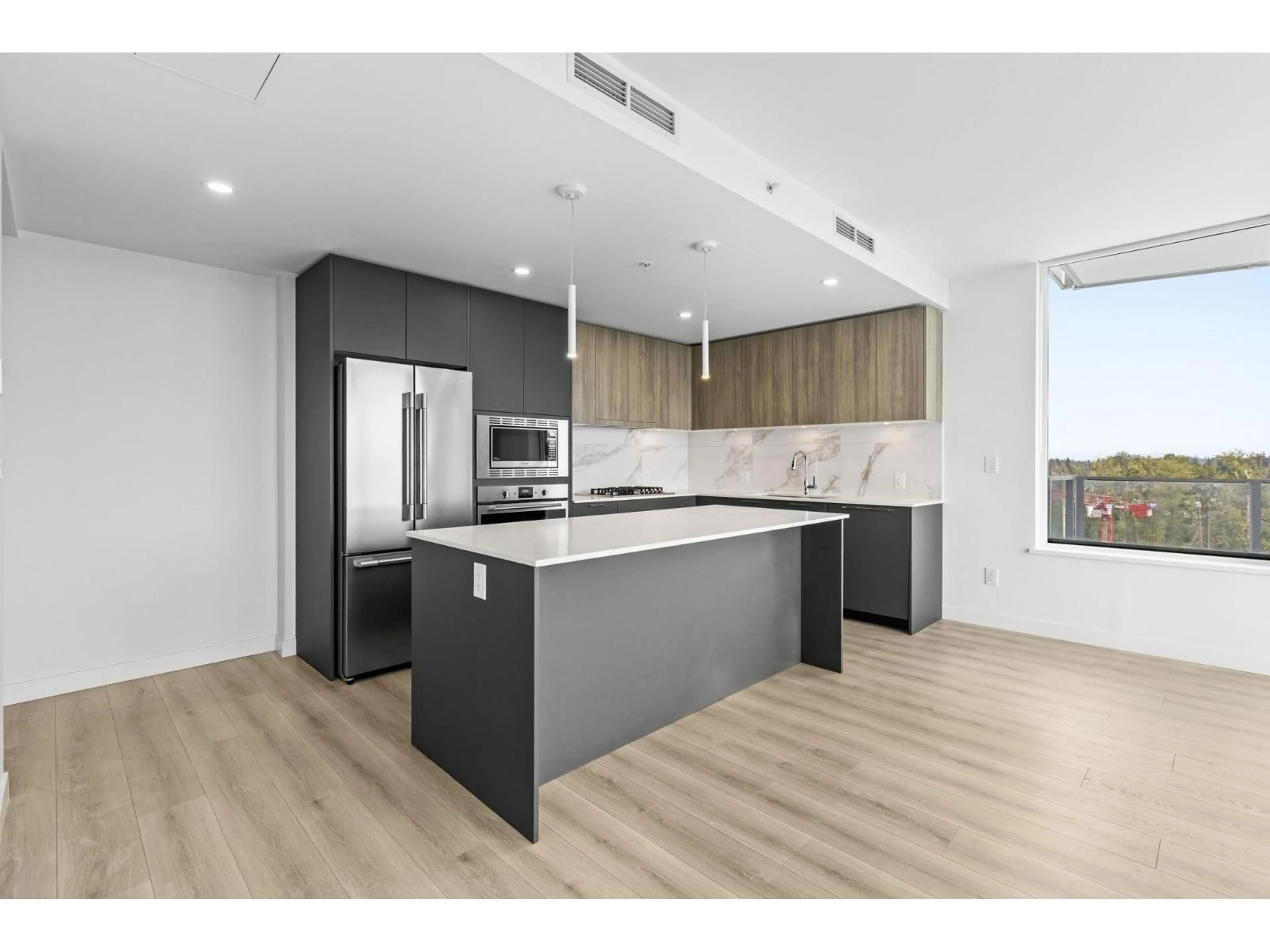 Open concept kitchen, wood/laminate floor for 1407 - 20065 85 AVENUE, Langley British Columbia V2Y3Y5