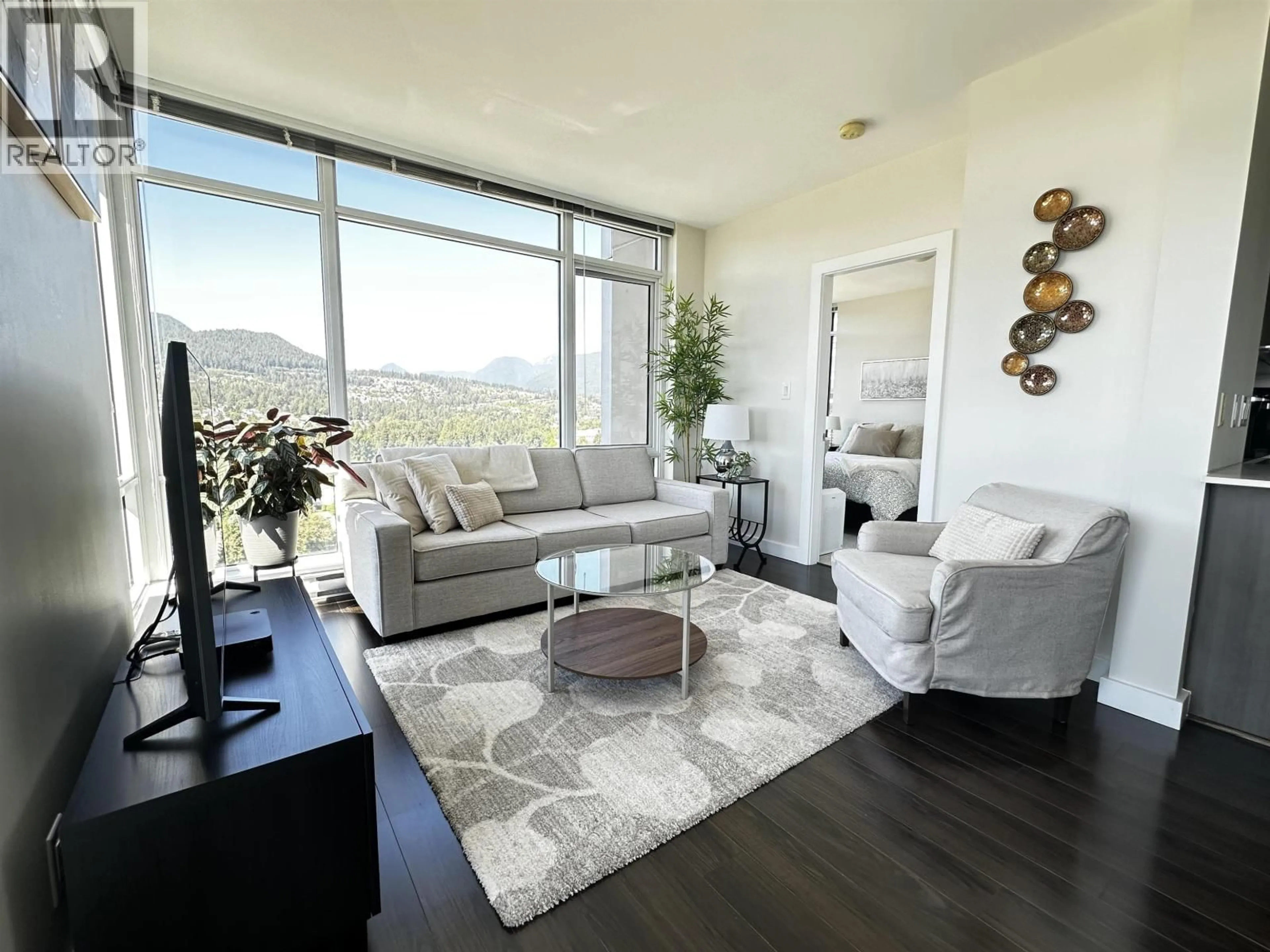 Living room with furniture, wood/laminate floor for 2709 - 2955 ATLANTIC AVENUE, Coquitlam British Columbia V3B0H9