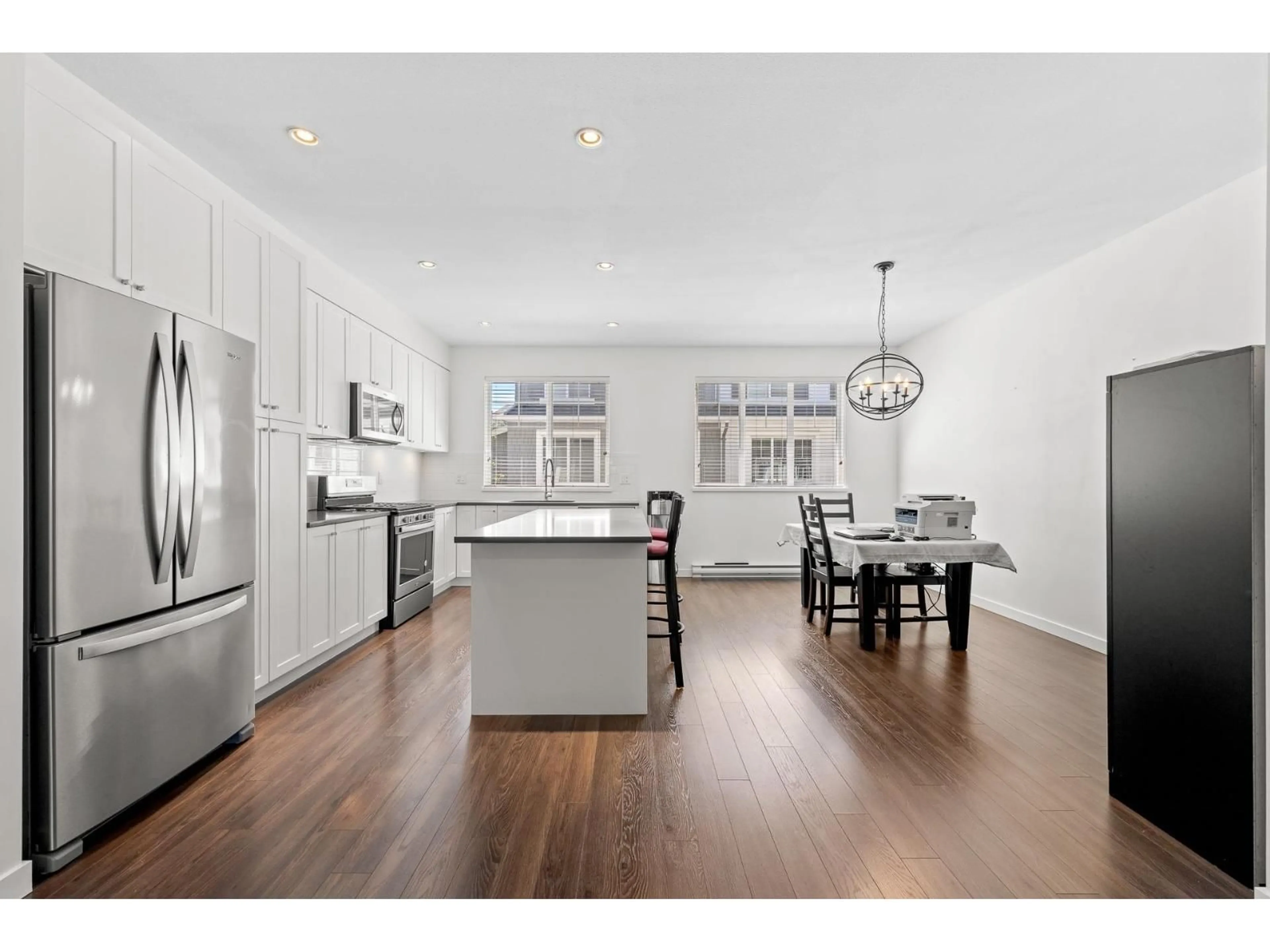 Open concept kitchen, wood/laminate floor for 30 - 127 172 STREET, Surrey British Columbia V3Z0W9