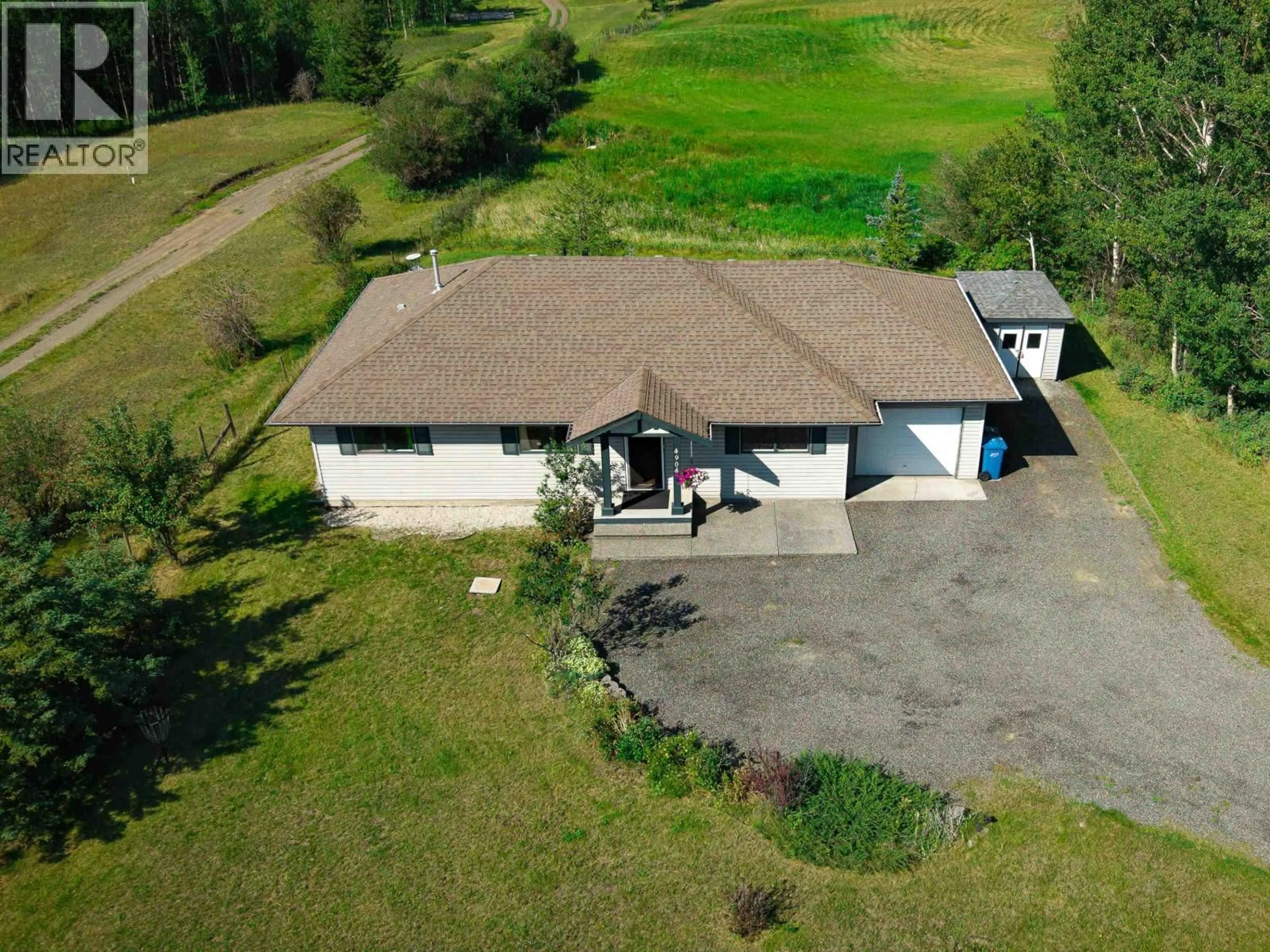 A pic from outside/outdoor area/front of a property/back of a property/a pic from drone, unknown for 4904 TELQUA DRIVE, 108 Mile Ranch British Columbia V0K2Z0