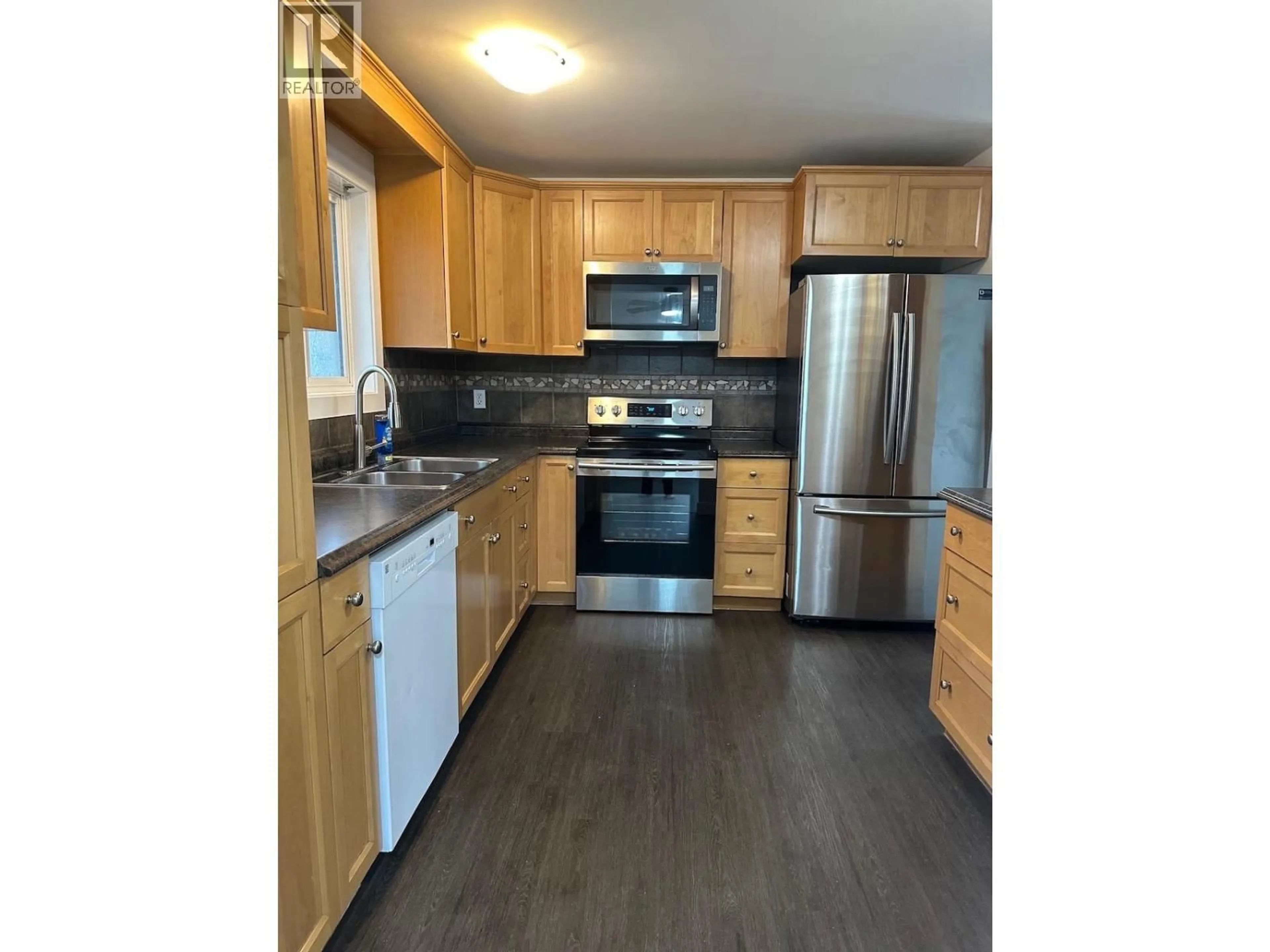 Standard kitchen, wood/laminate floor for 9015 91 AVENUE, Fort St. John British Columbia V1J4W3