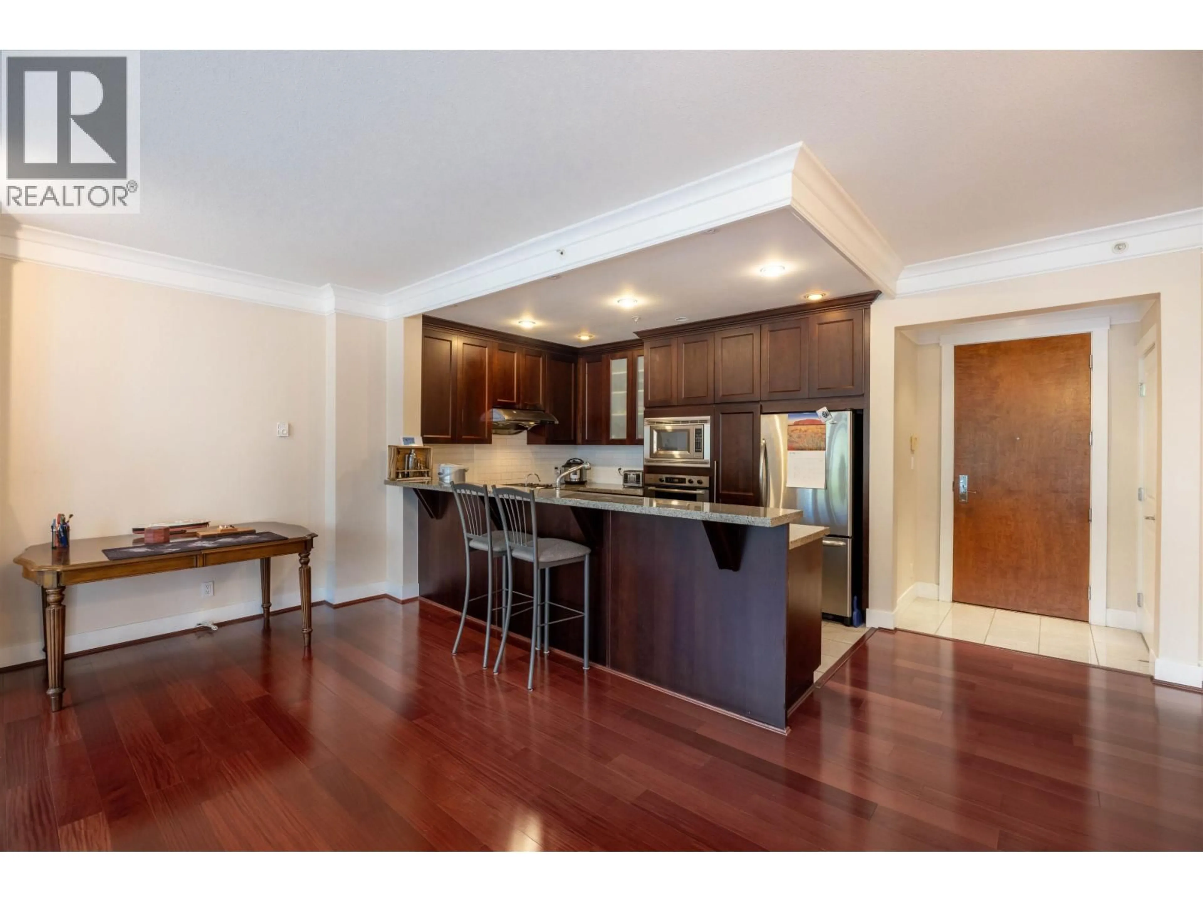 Open concept kitchen, wood/laminate floor for 218 - 4685 VALLEY DRIVE, Vancouver British Columbia V6J5M2