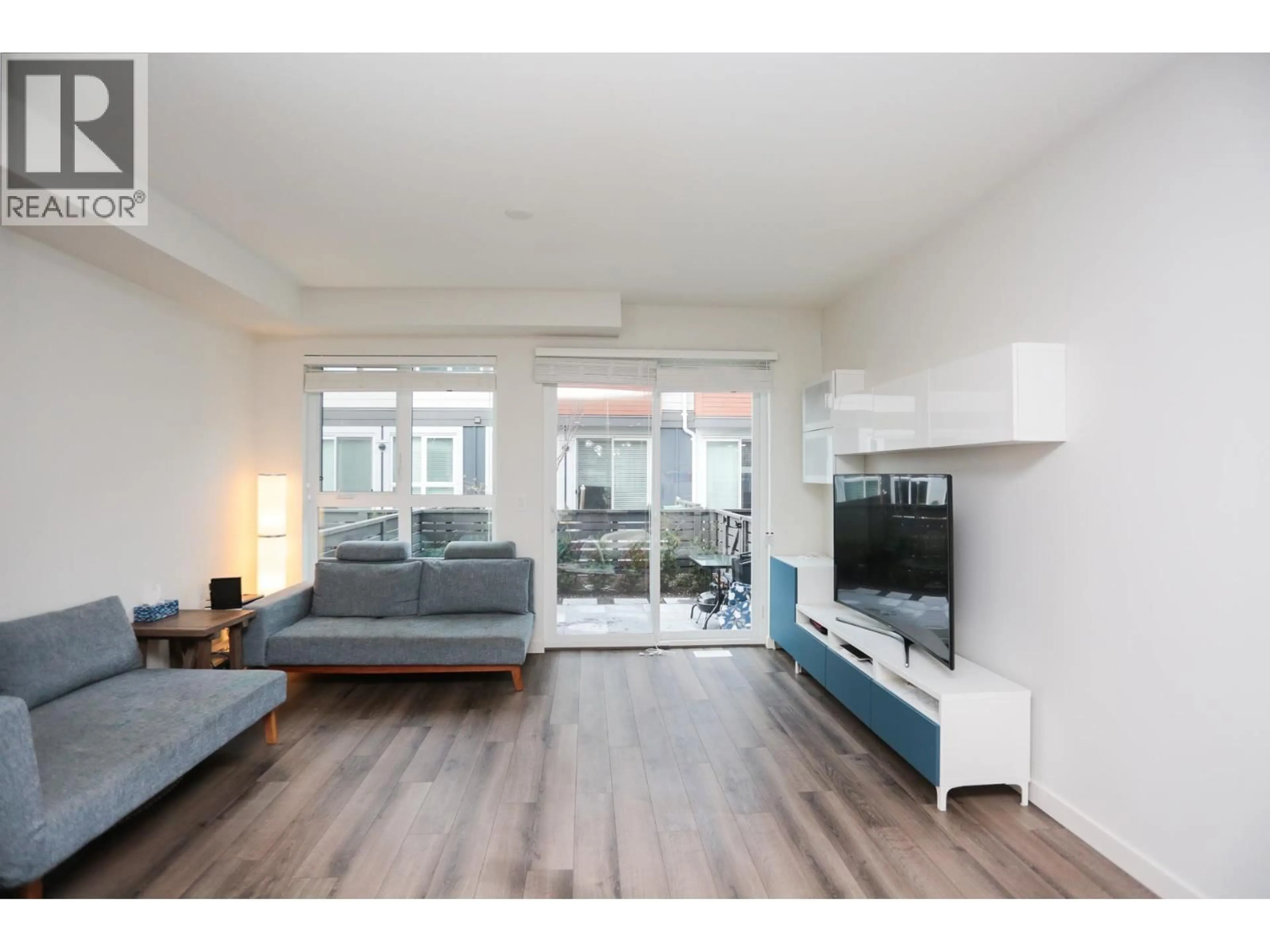 Living room with furniture, wood/laminate floor for 65 - 10311 RIVER DRIVE, Richmond British Columbia V6X0T2