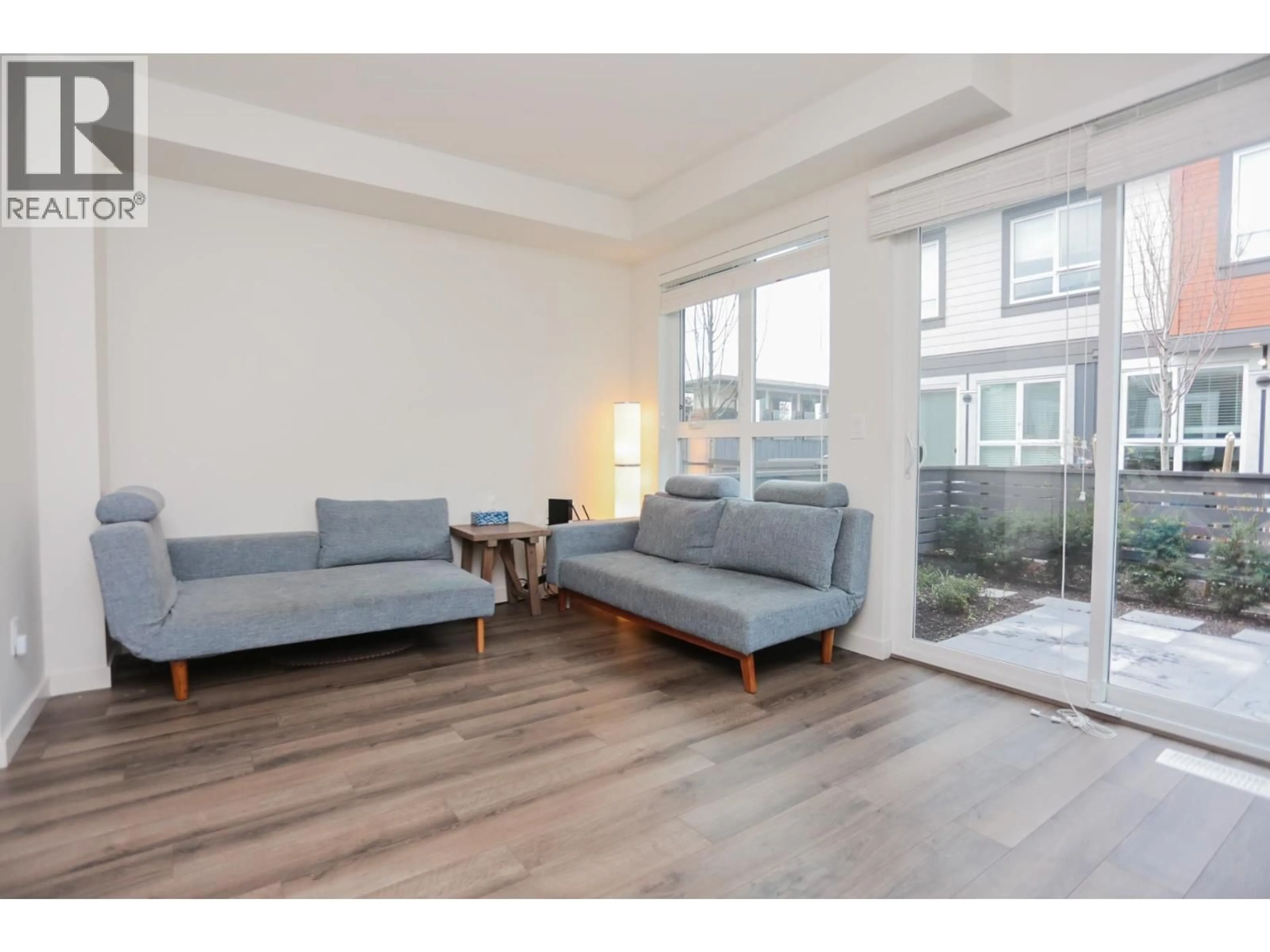 Living room with furniture, wood/laminate floor for 65 - 10311 RIVER DRIVE, Richmond British Columbia V6X0T2