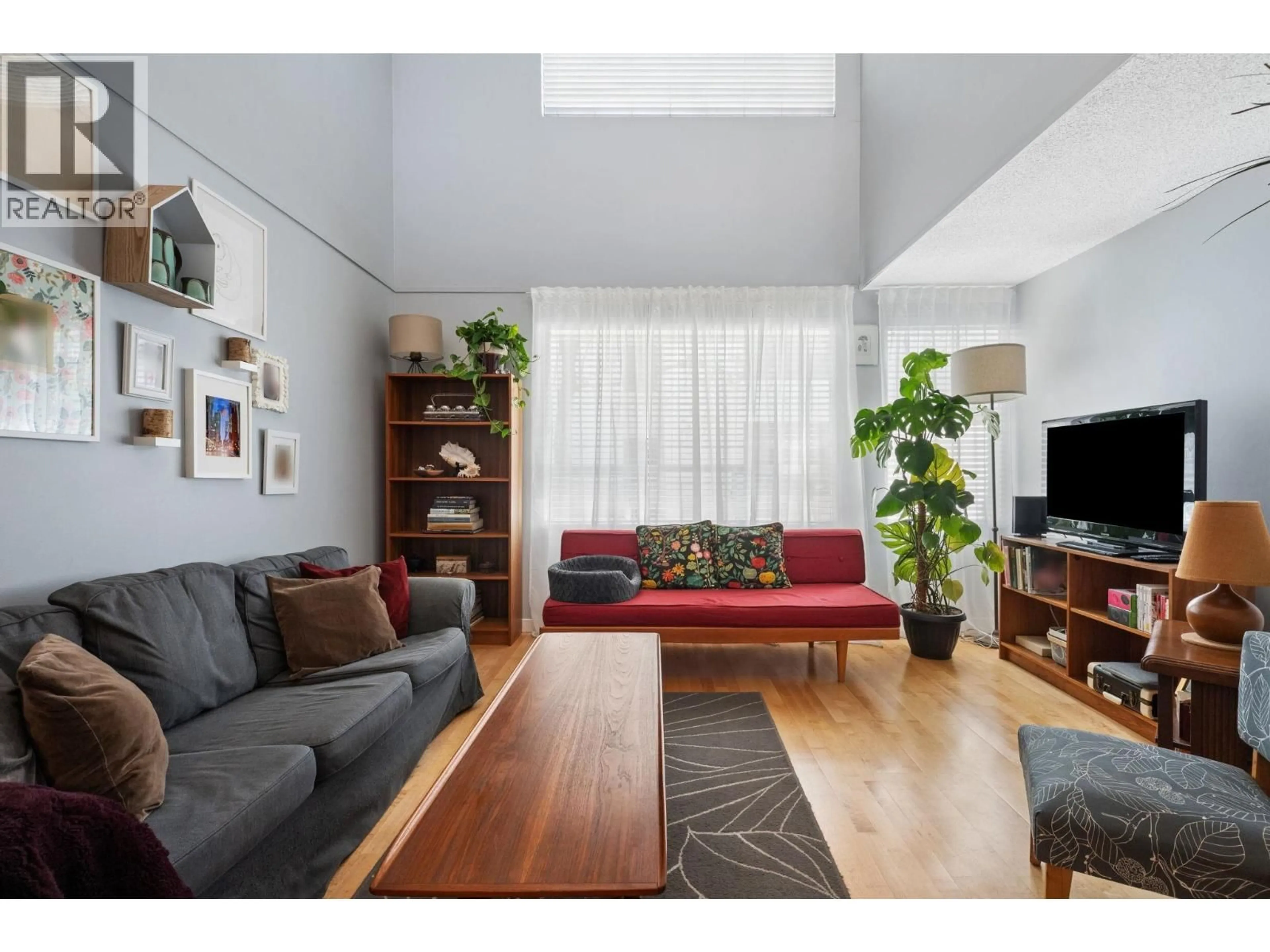 Living room with furniture, wood/laminate floor for 407 - 1345 COMOX STREET, Vancouver British Columbia V6E4E4