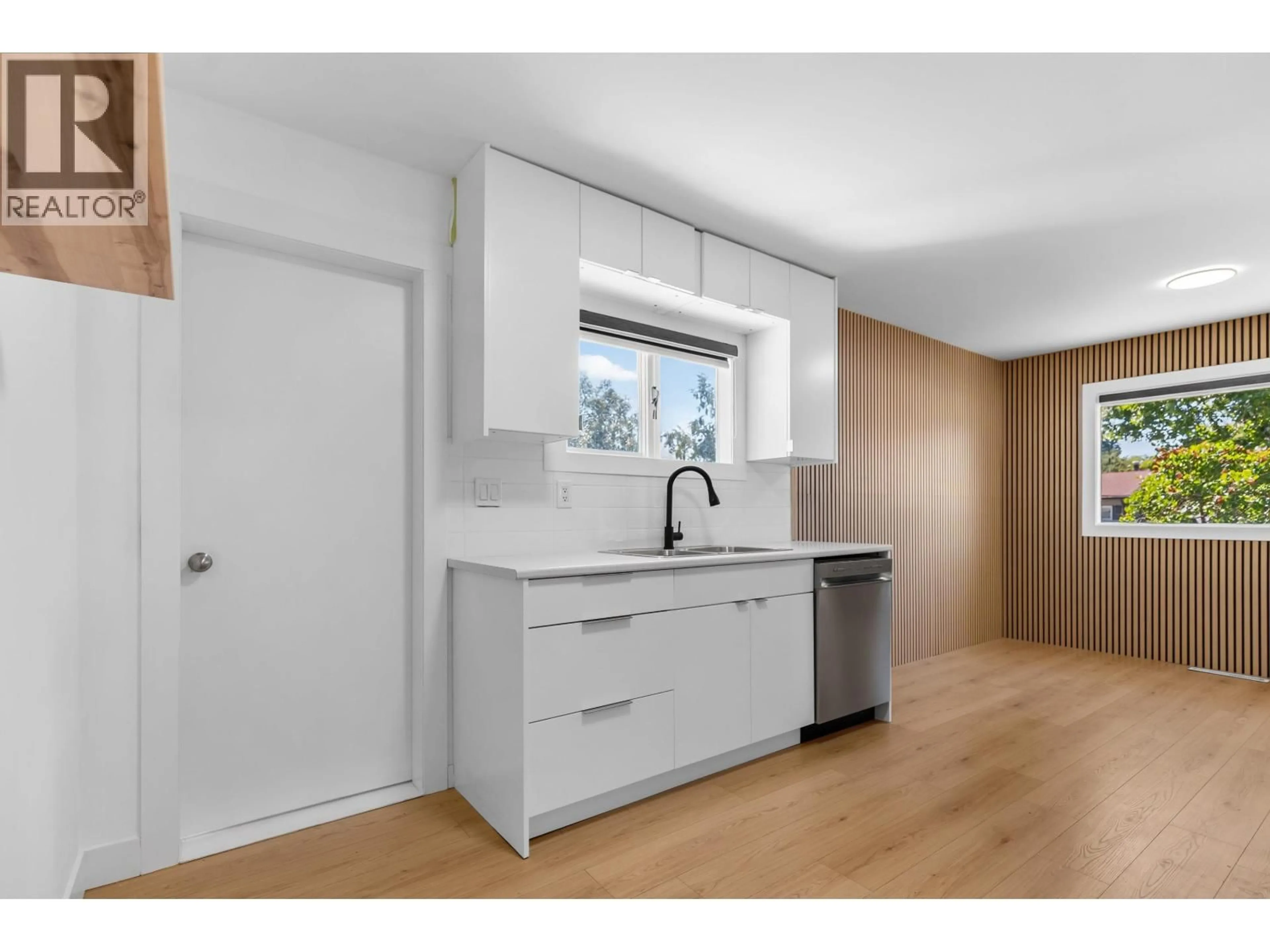 Open concept kitchen, wood/laminate floor for 1510 ALWARD STREET, Prince George British Columbia V2M2G6