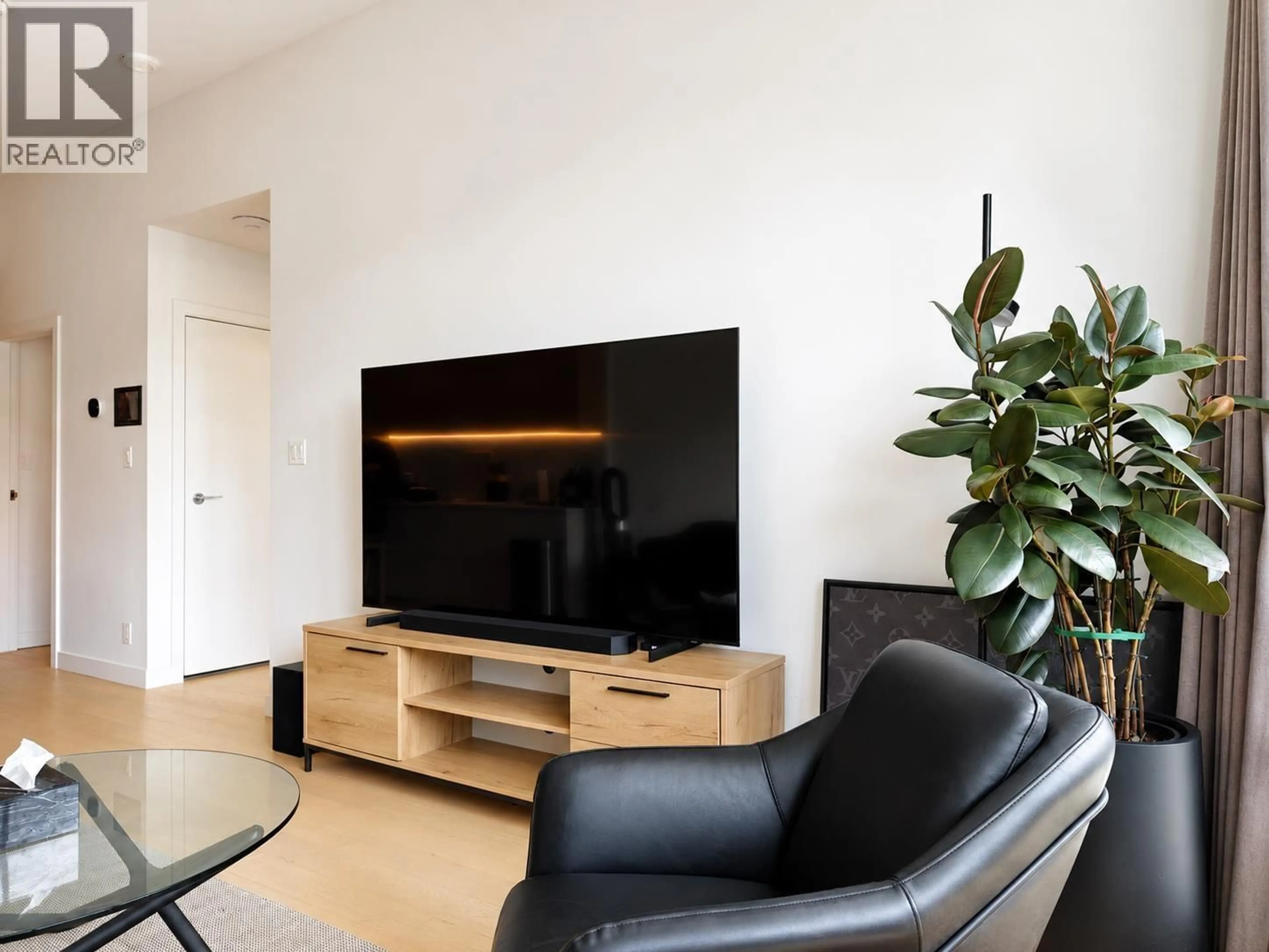 Living room with furniture, wood/laminate floor for 203 - 6622 PEARSON WAY, Richmond British Columbia V7C0E4