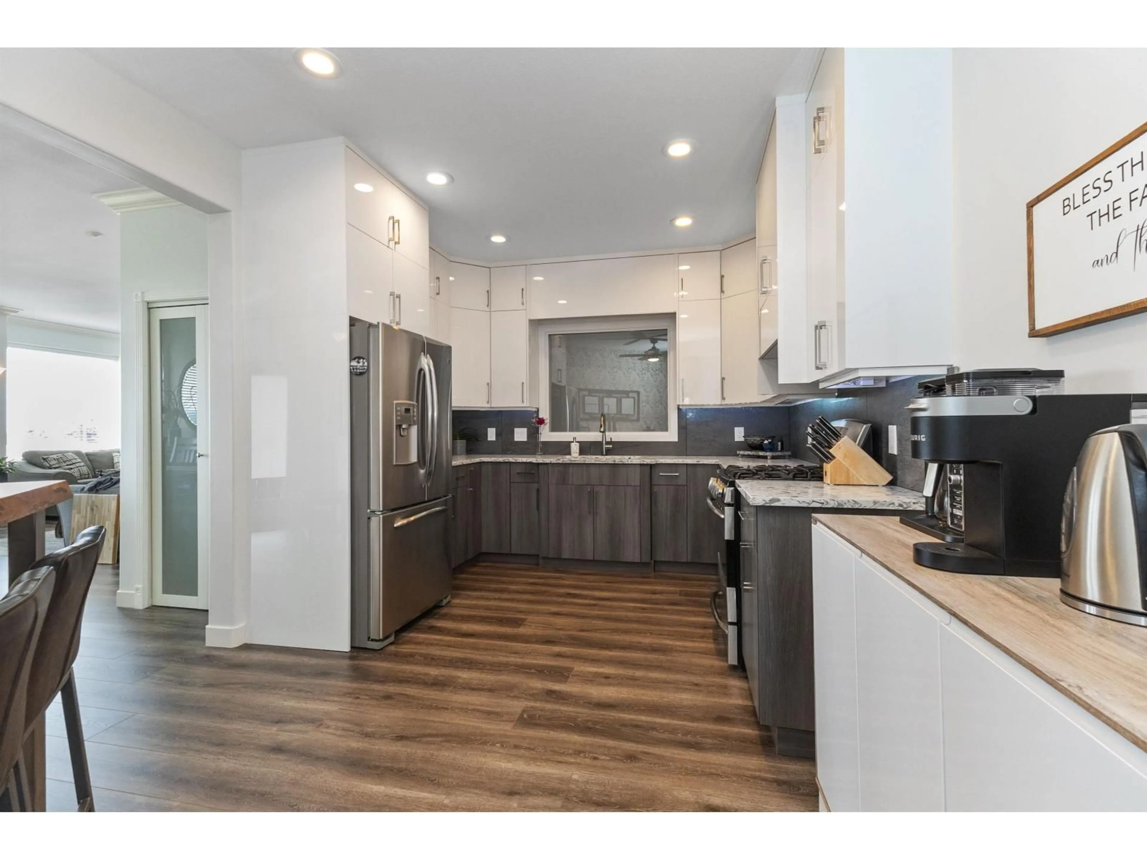 Open concept kitchen, wood/laminate floor for 2764 ST MORITZ WAY, Abbotsford British Columbia V3G1C3