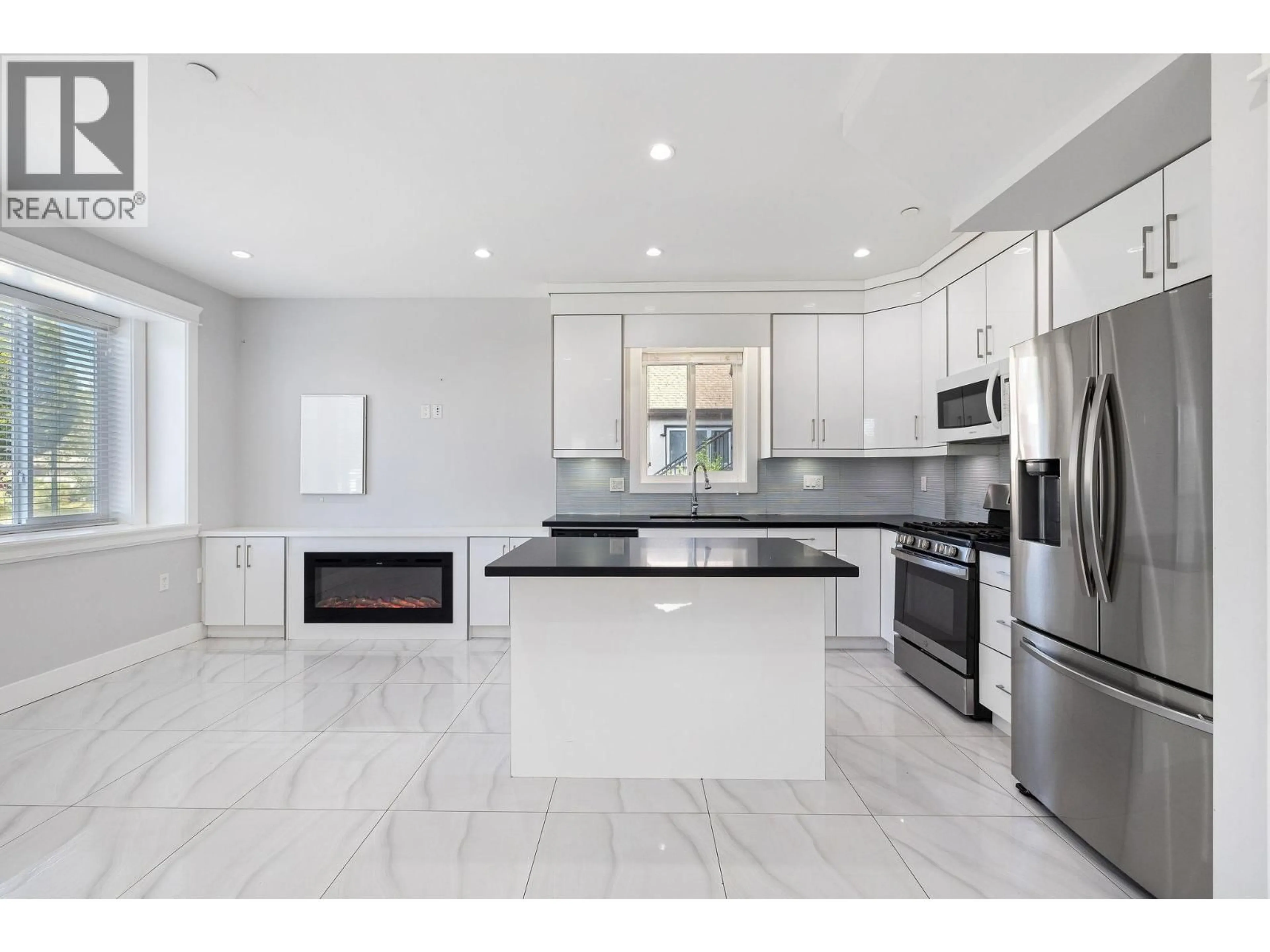 Open concept kitchen, ceramic/tile floor for 1 - 2430 41 STREET, Vancouver British Columbia V5R2W4