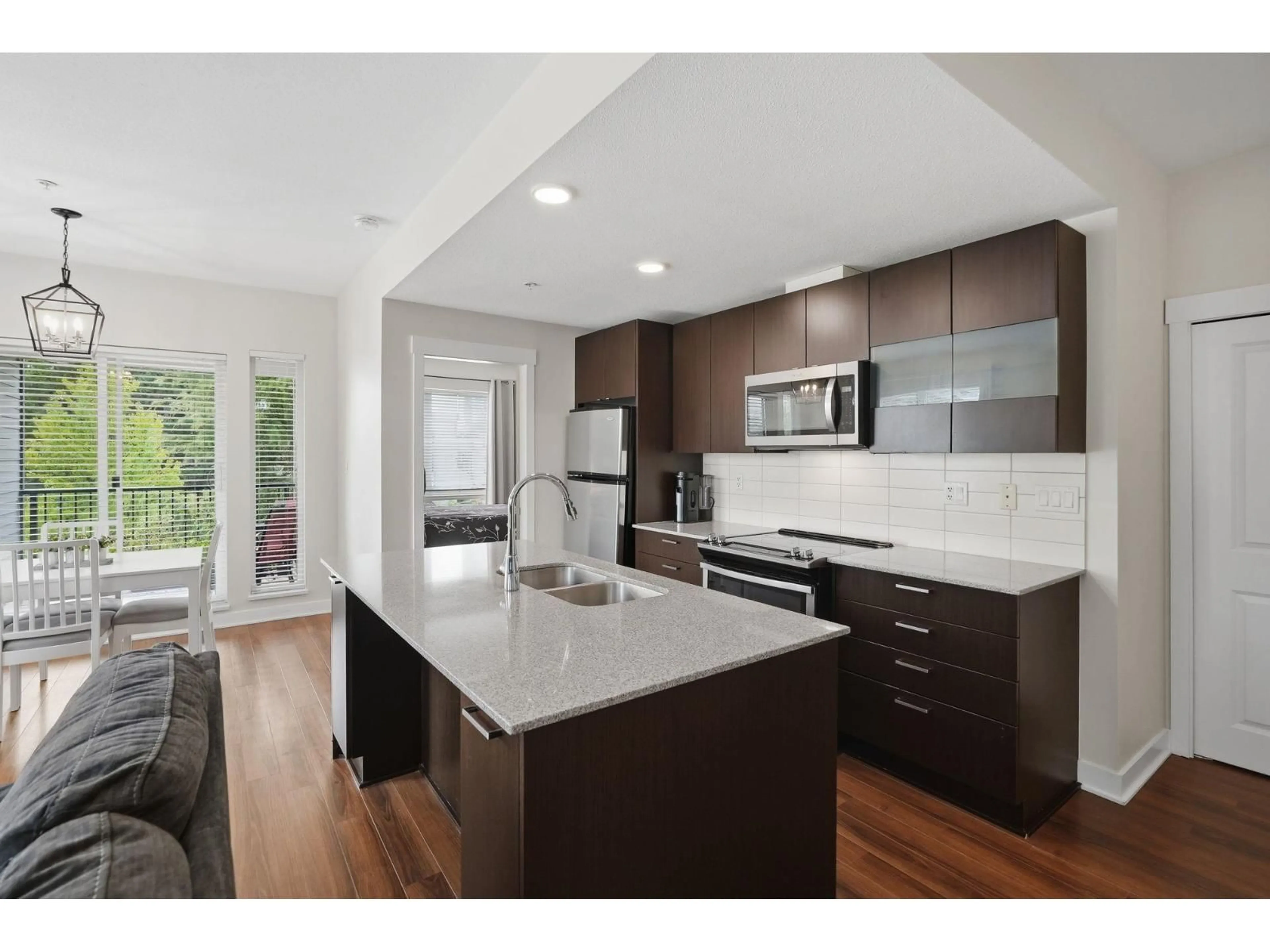 Open concept kitchen, unknown for 304 - 13339 102A AVENUE, Surrey British Columbia V3T0C5