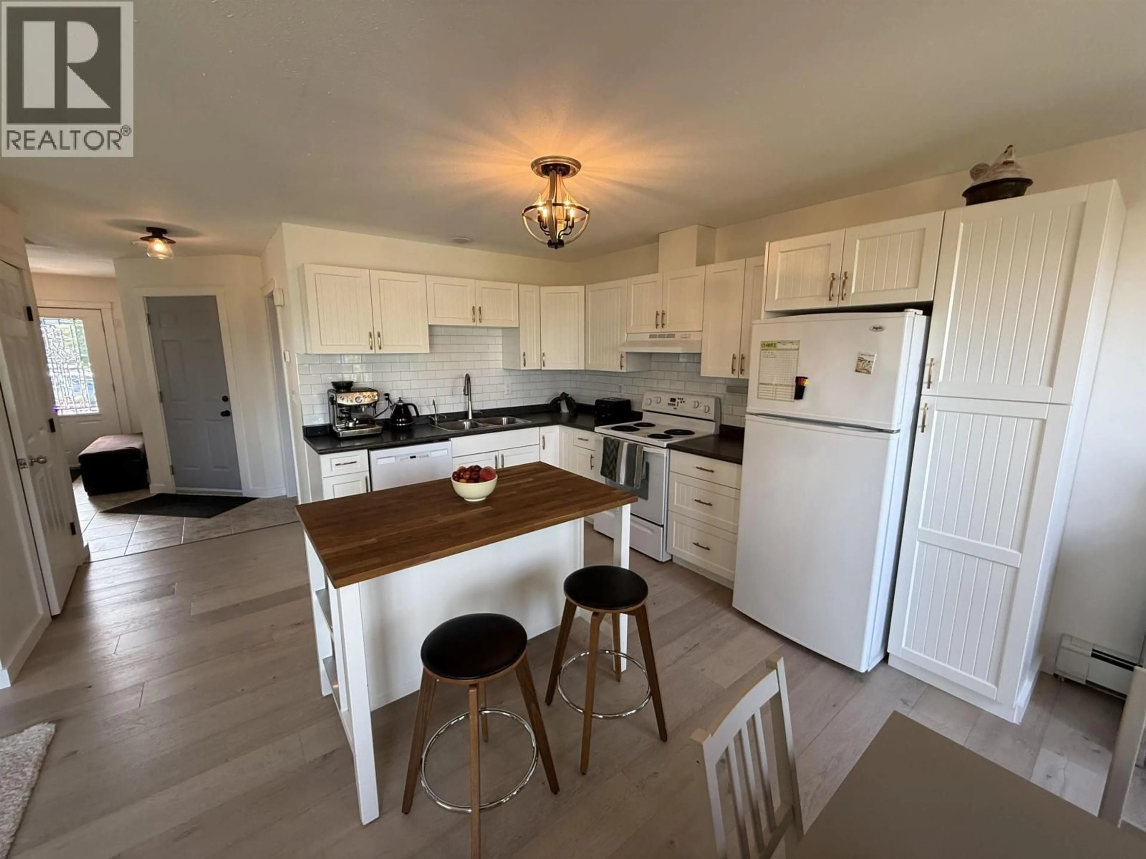 Standard kitchen, wood/laminate floor for 10008 112 AVENUE, Fort St. John British Columbia V1J6G6